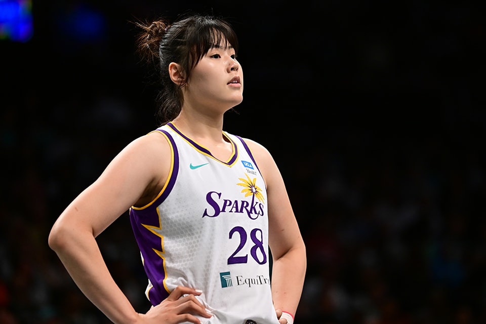 Li Yueru #28 of the Los Angeles Sparks looks on during the game against the New York Liberty