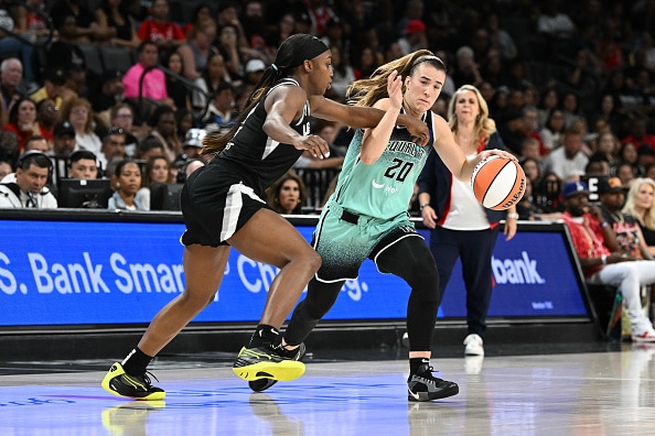 Jackie Young #0 of the Las Vegas Aces and Sabrina Ionescu #20 of the New York Liberty