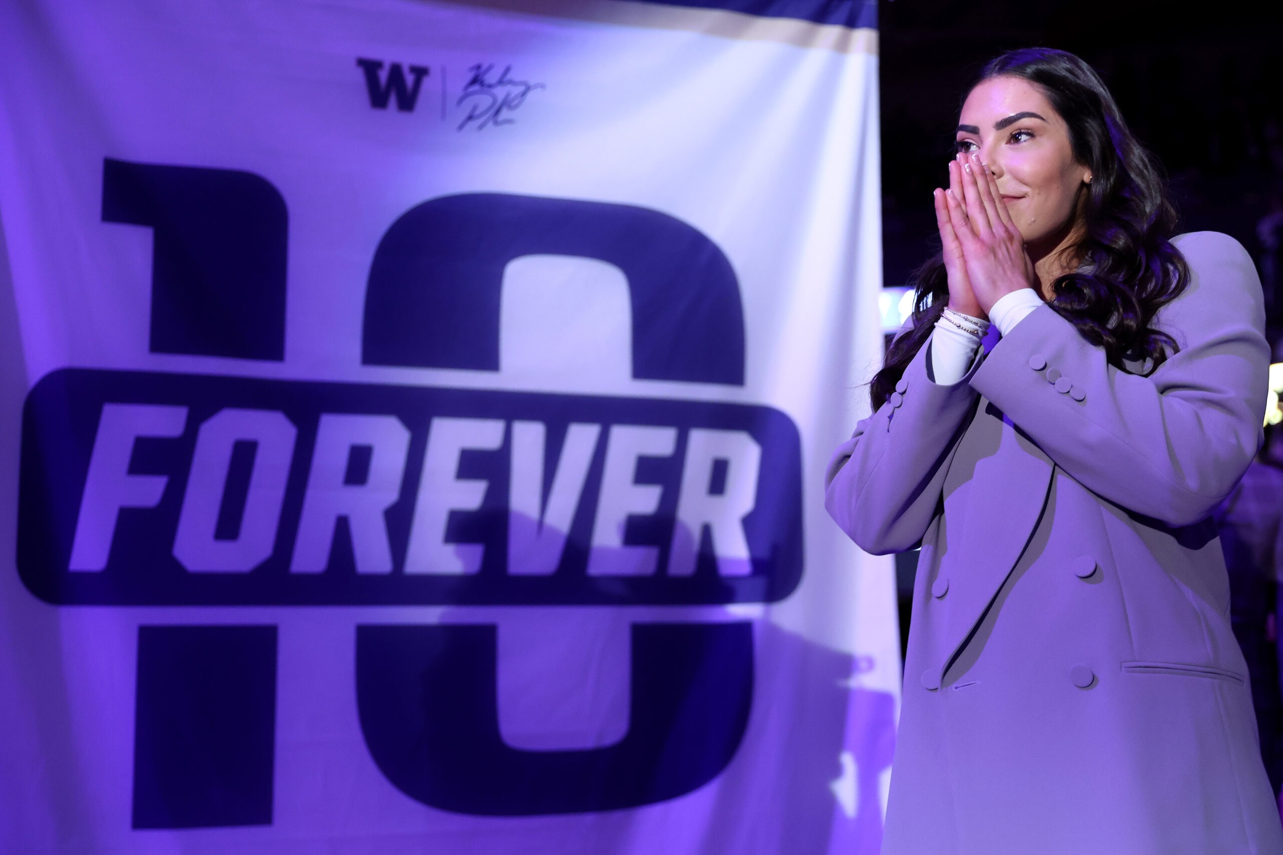 Former Washington Huskies women’s basketball player Kelsey Plum reacts during her #10 jersey retirement ceremony during halftime between the Washington Huskies Purdue Boilermakers