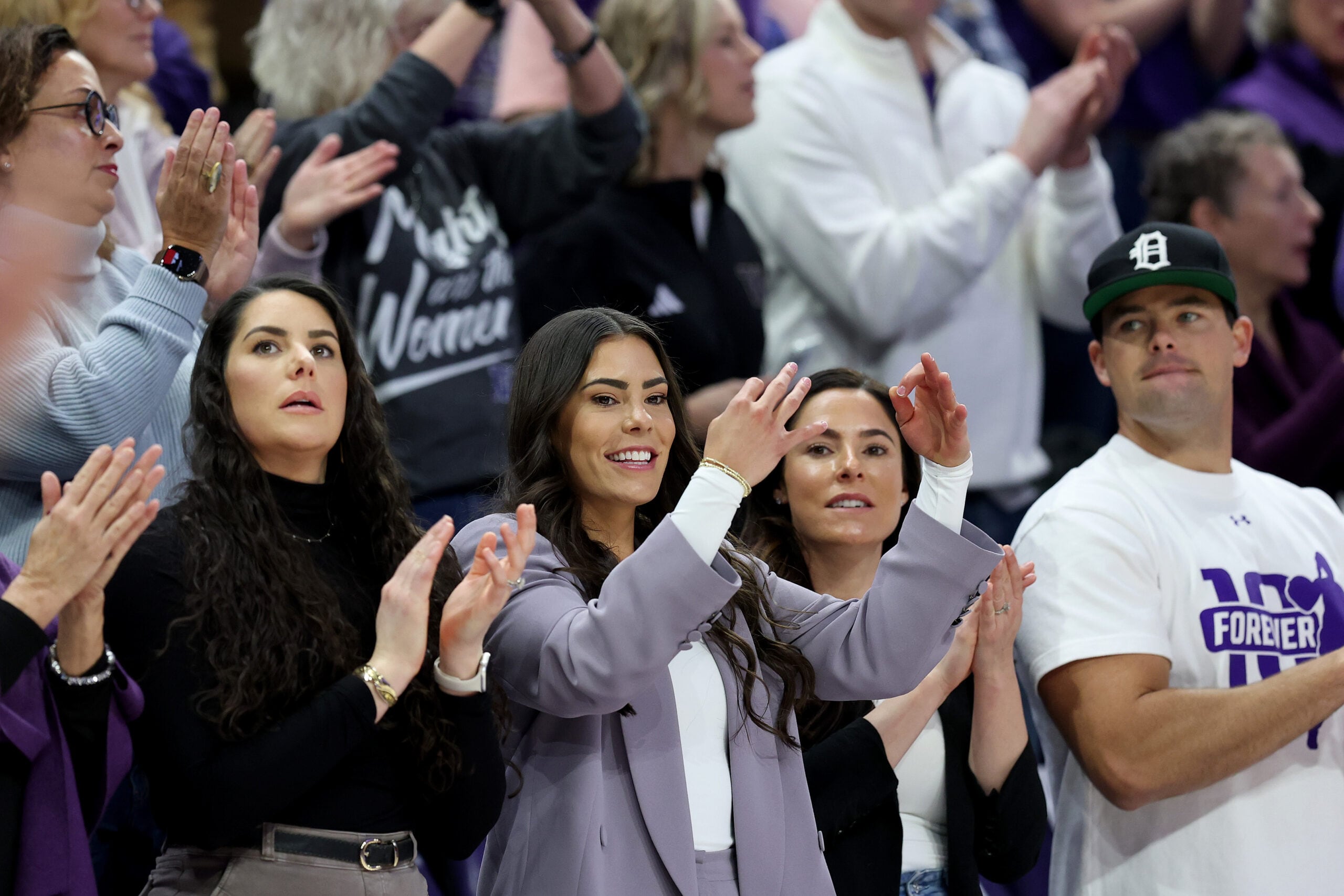 Kelsey Plum watches the game before her #10 jersey retirement ceremony