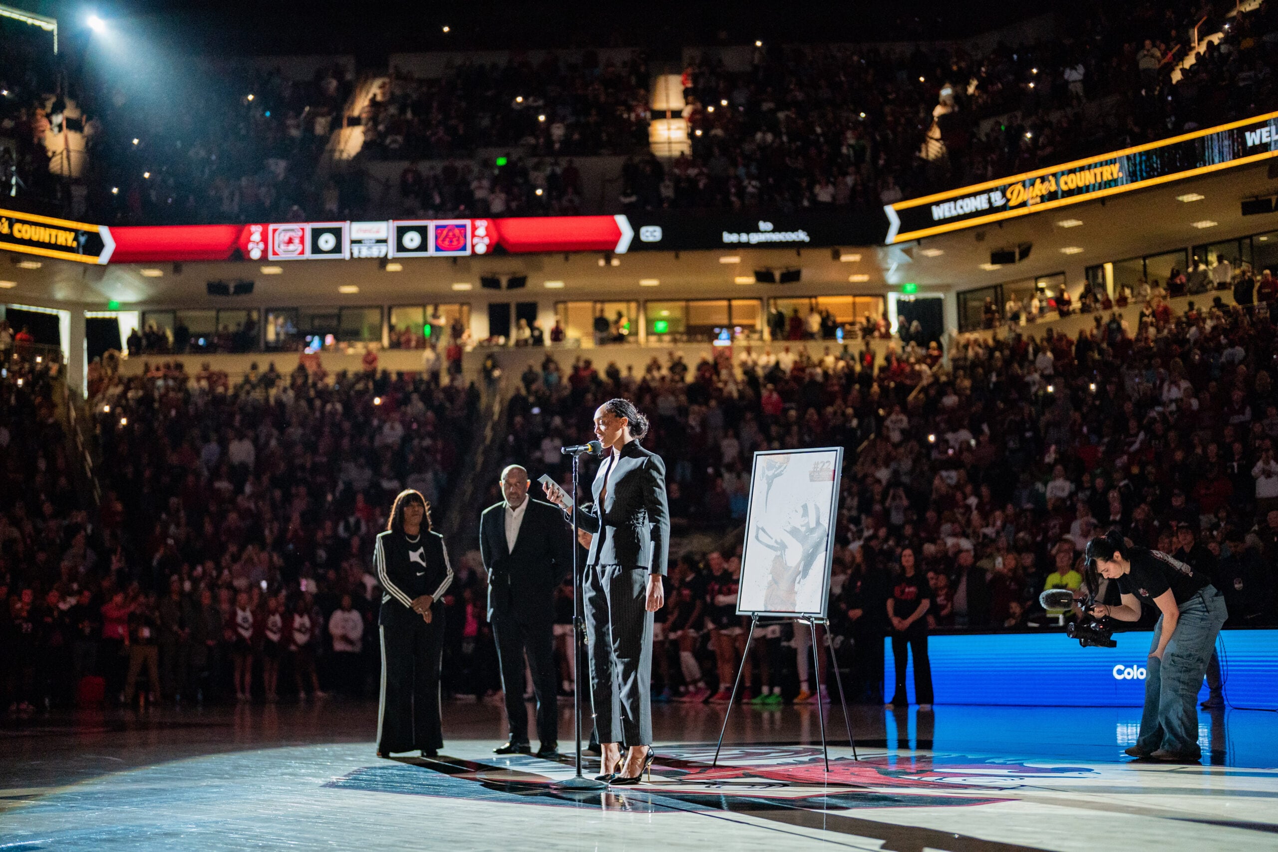 A'ja Wilson speaks to the crowd during her jersey retirement ceremony