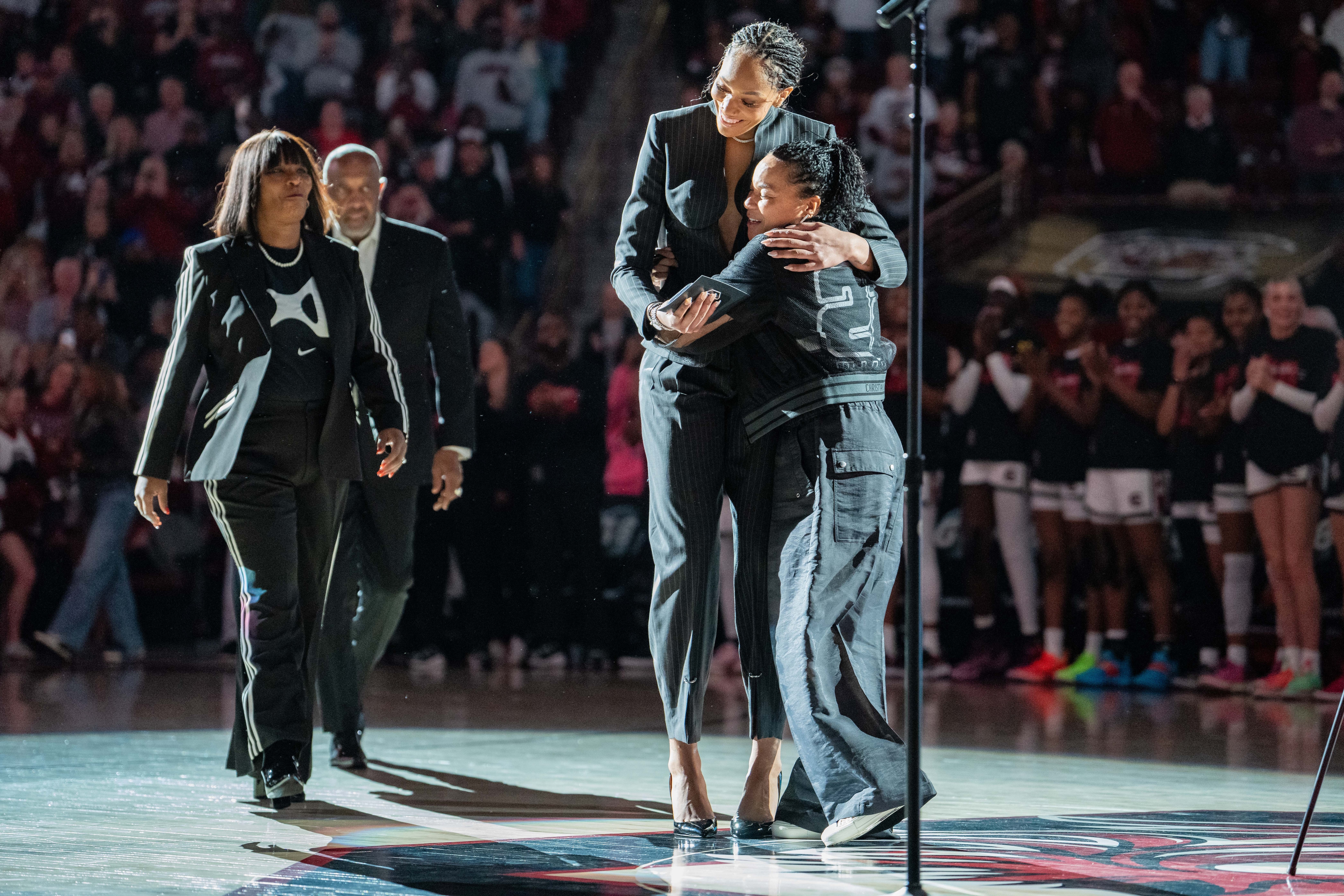 A'ja Wilson hugs head coach Dawn Staley of the South Carolina Gamecocks before her jersey retirement ceremony