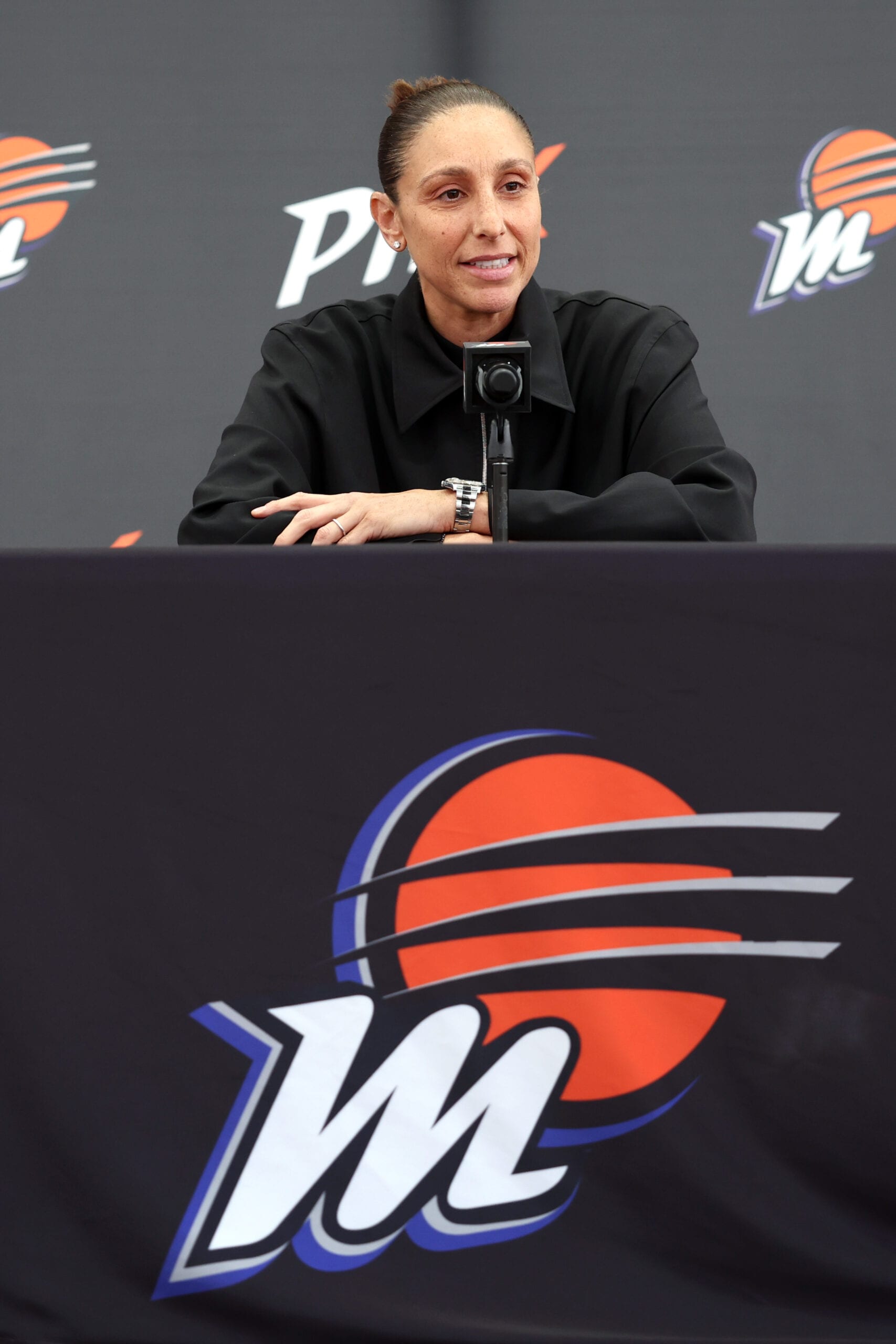 Diana Taurasi speaks at the microphone during her retirement press conference