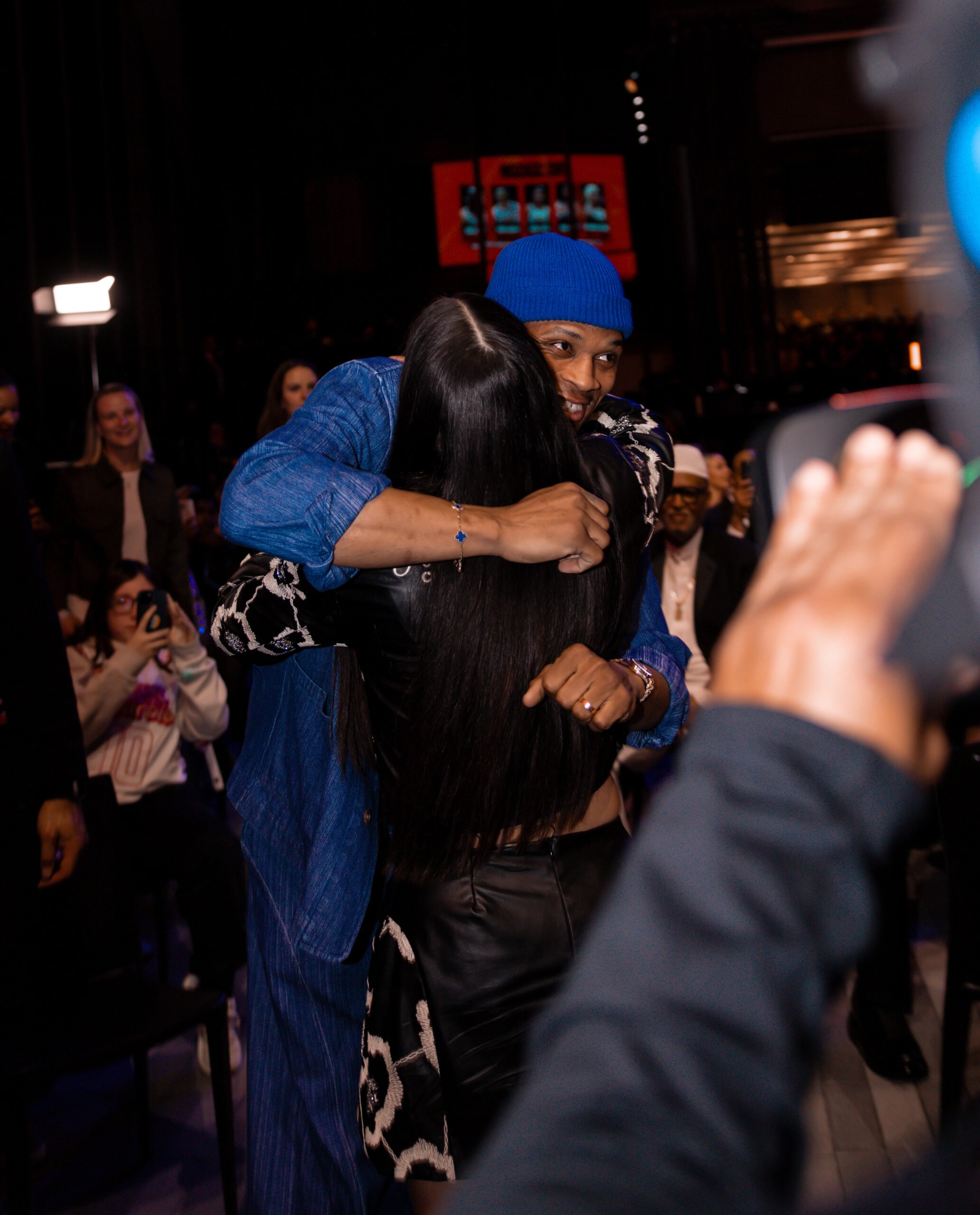 Georgia Amoore hugging Russell Westbrook at the 2025 WNBA Draft after being selected No. 6