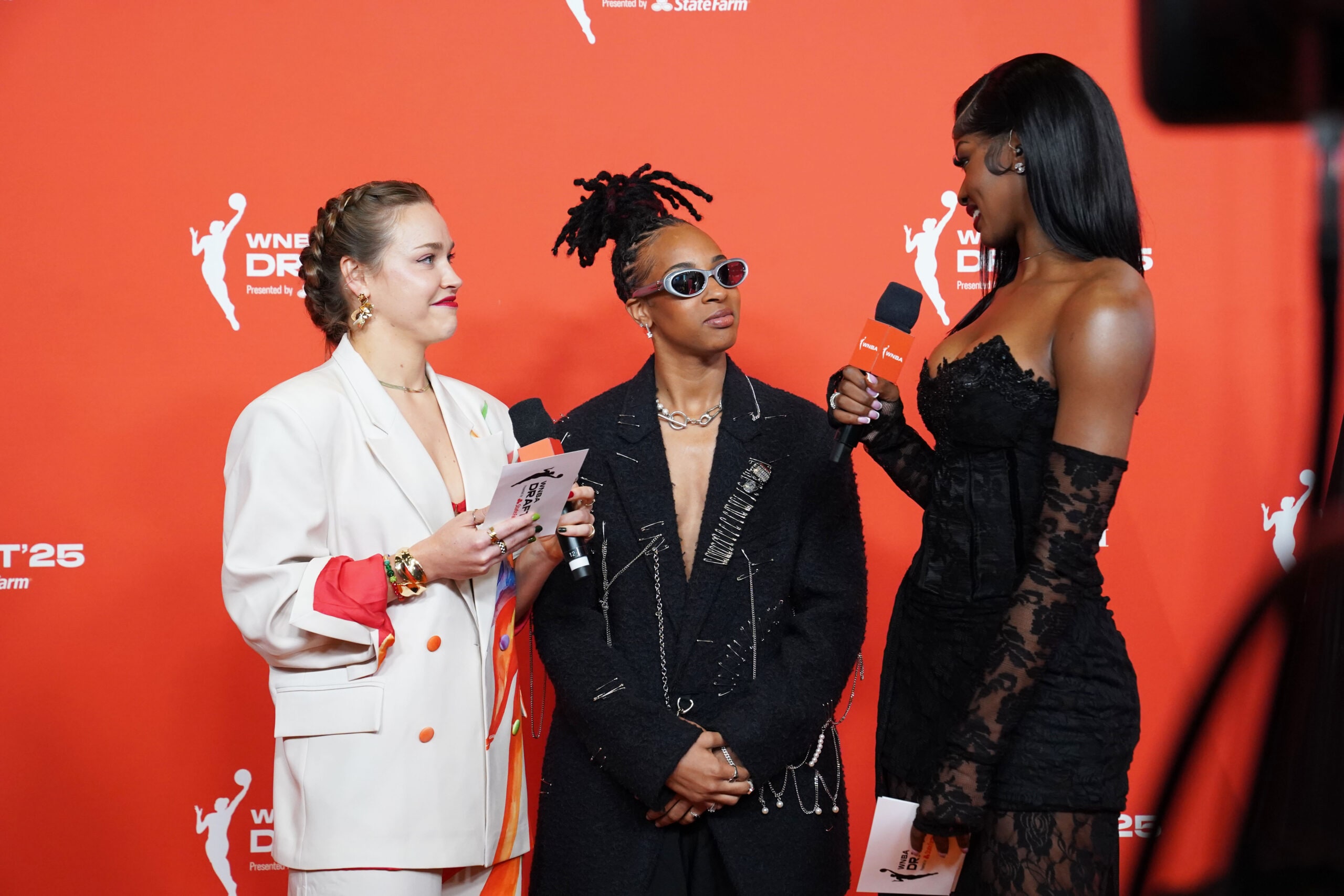 Aziaha James talks to Rickea Jackson and Hannah O'Flynn on the orange carpet ahead of the 2025 WNBA Draft.