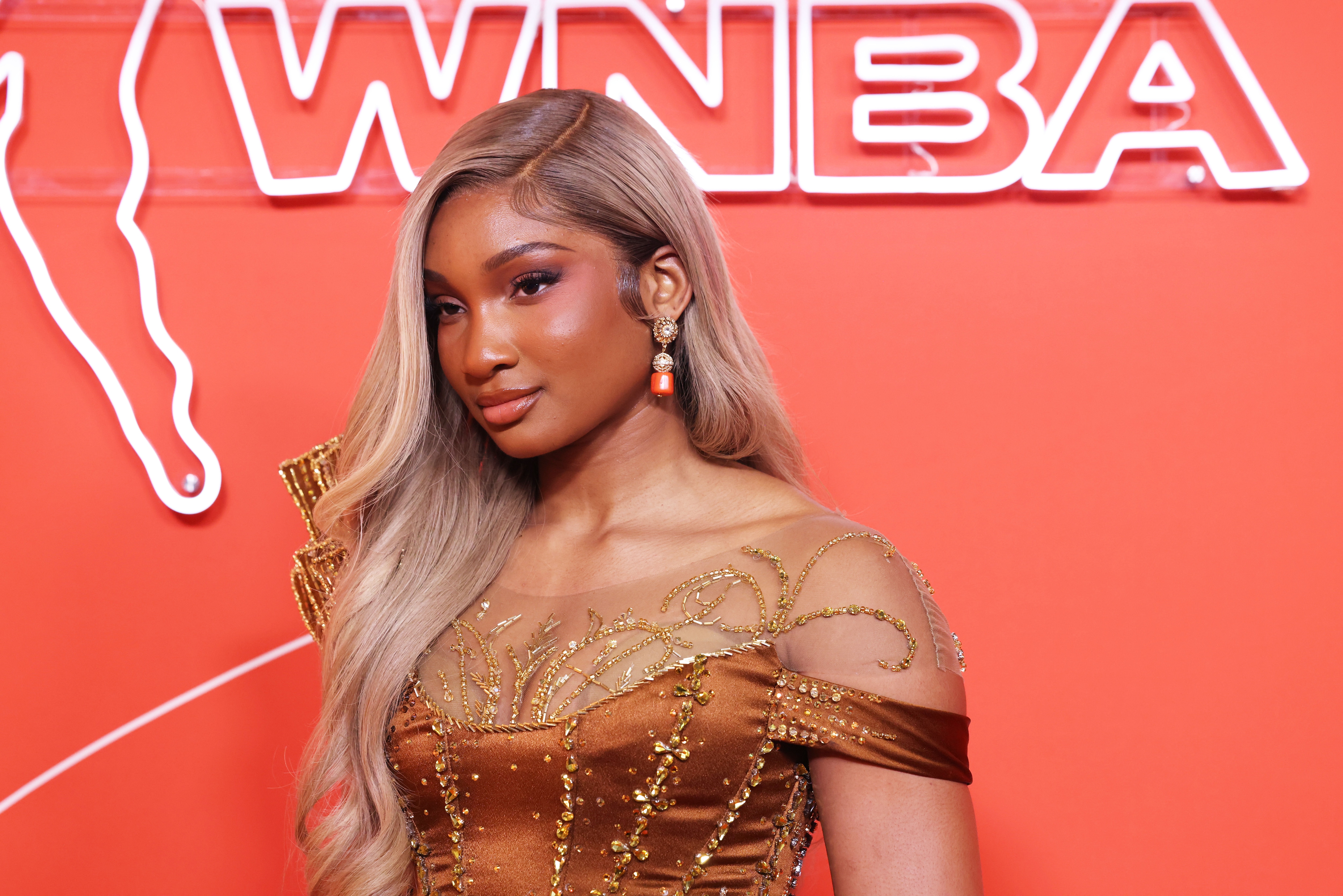 Kiki Iriafen walks the orange carpet ahead of the 2025 WNBA Draft.