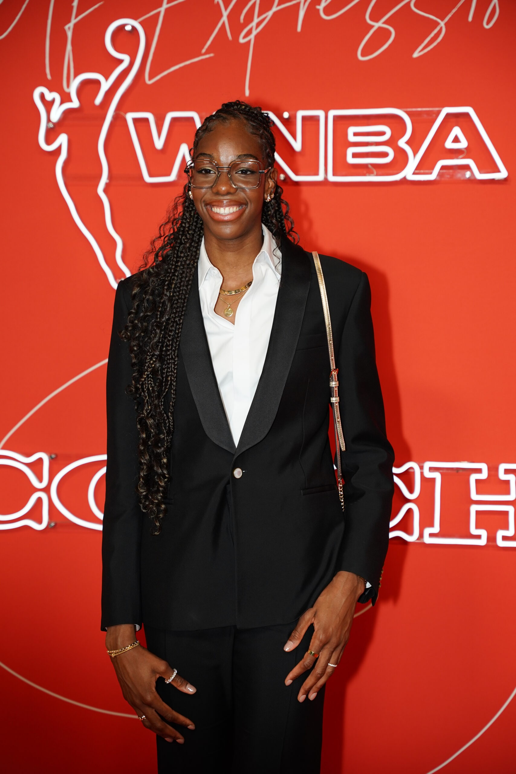 Dominique Malonga poses for a photo on the orange carpet ahead of the 2025 WNBA Draft.