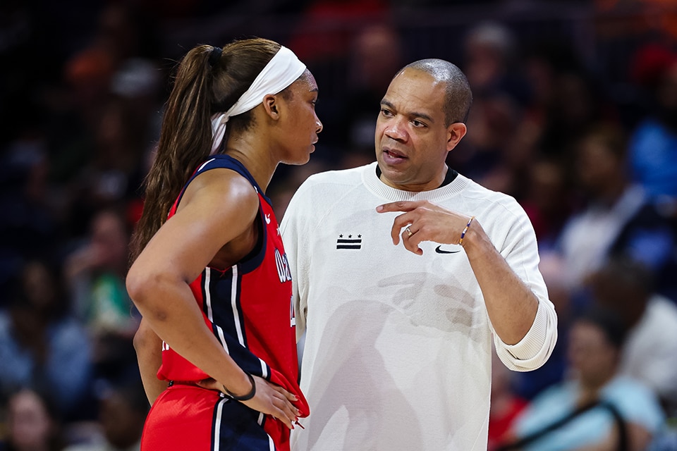 Kiki Iriafen and Head Coach Sydney Johnson