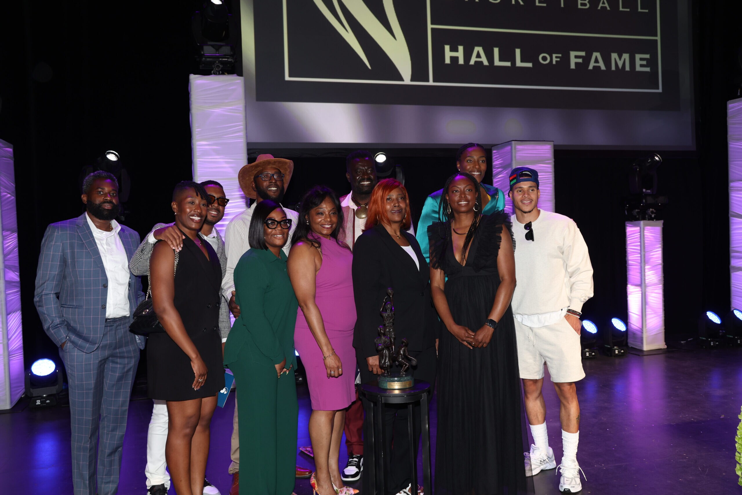 Sylvia Fowles poses for a picture with her family after being officially inducted into the Women’s Basketball Hall of Fame