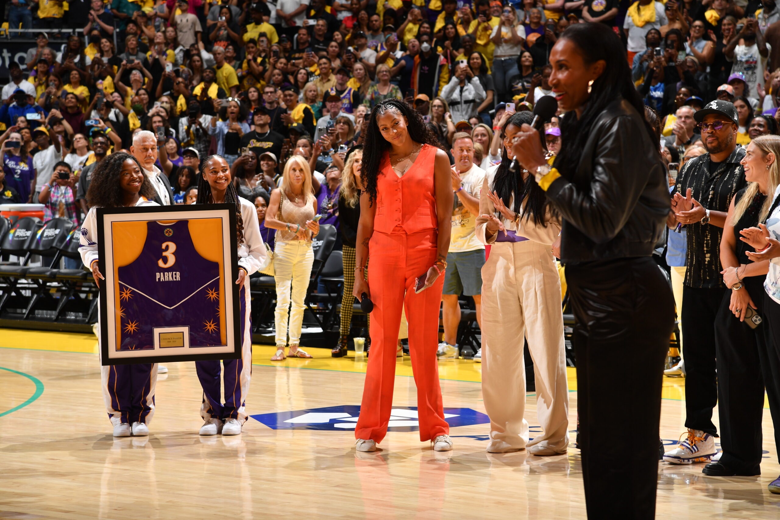 Candace Parker looks on at Lisa Leslie during Parker's Los Angeles Sparks jersey retirement