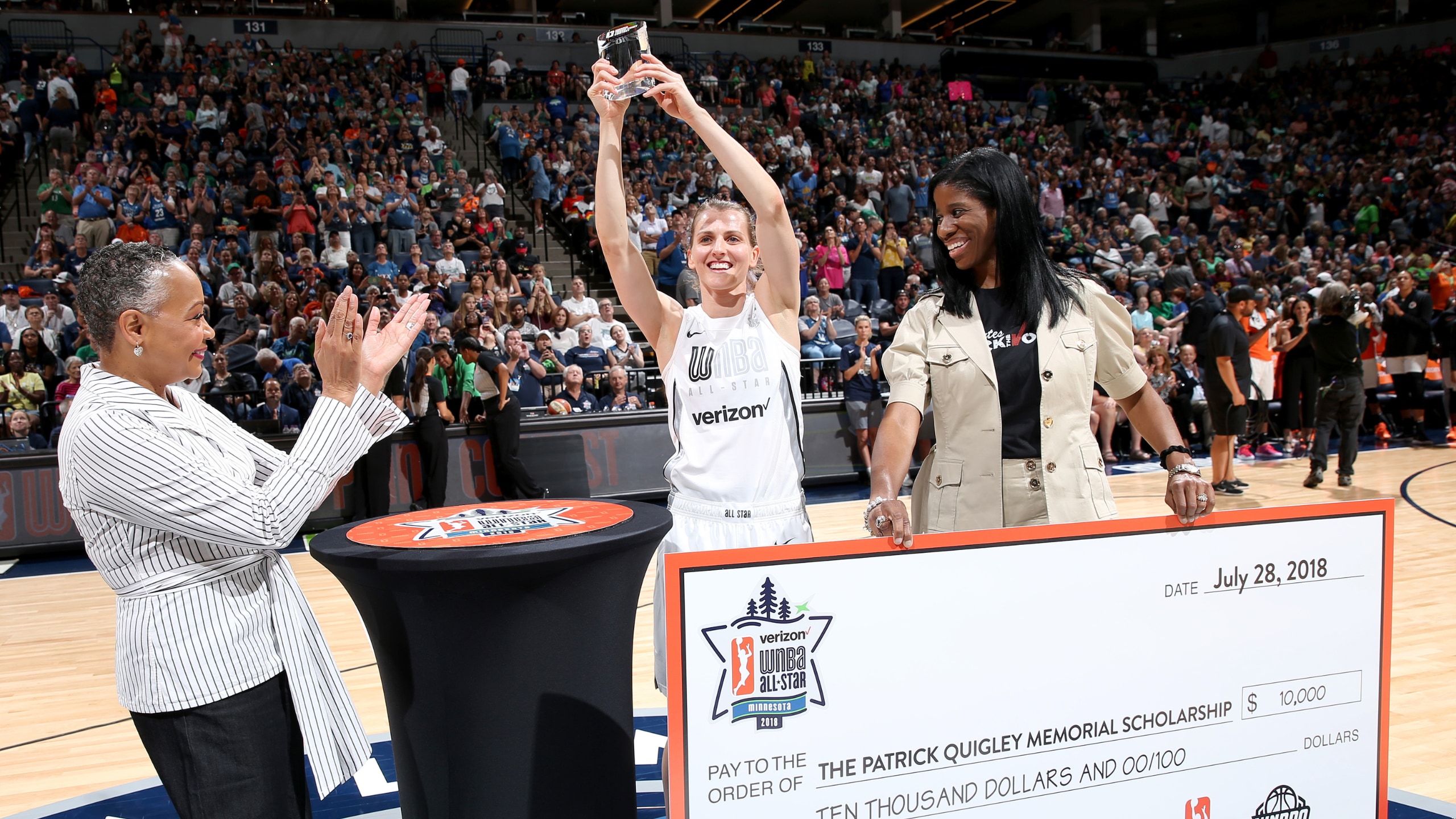 WNBA President Lisa Borders presents Allie Quigley #14 of the Chicago Sky with the Trophy during the Three-Point Contest during halftime during the Verizon WNBA All-Star Game 2018