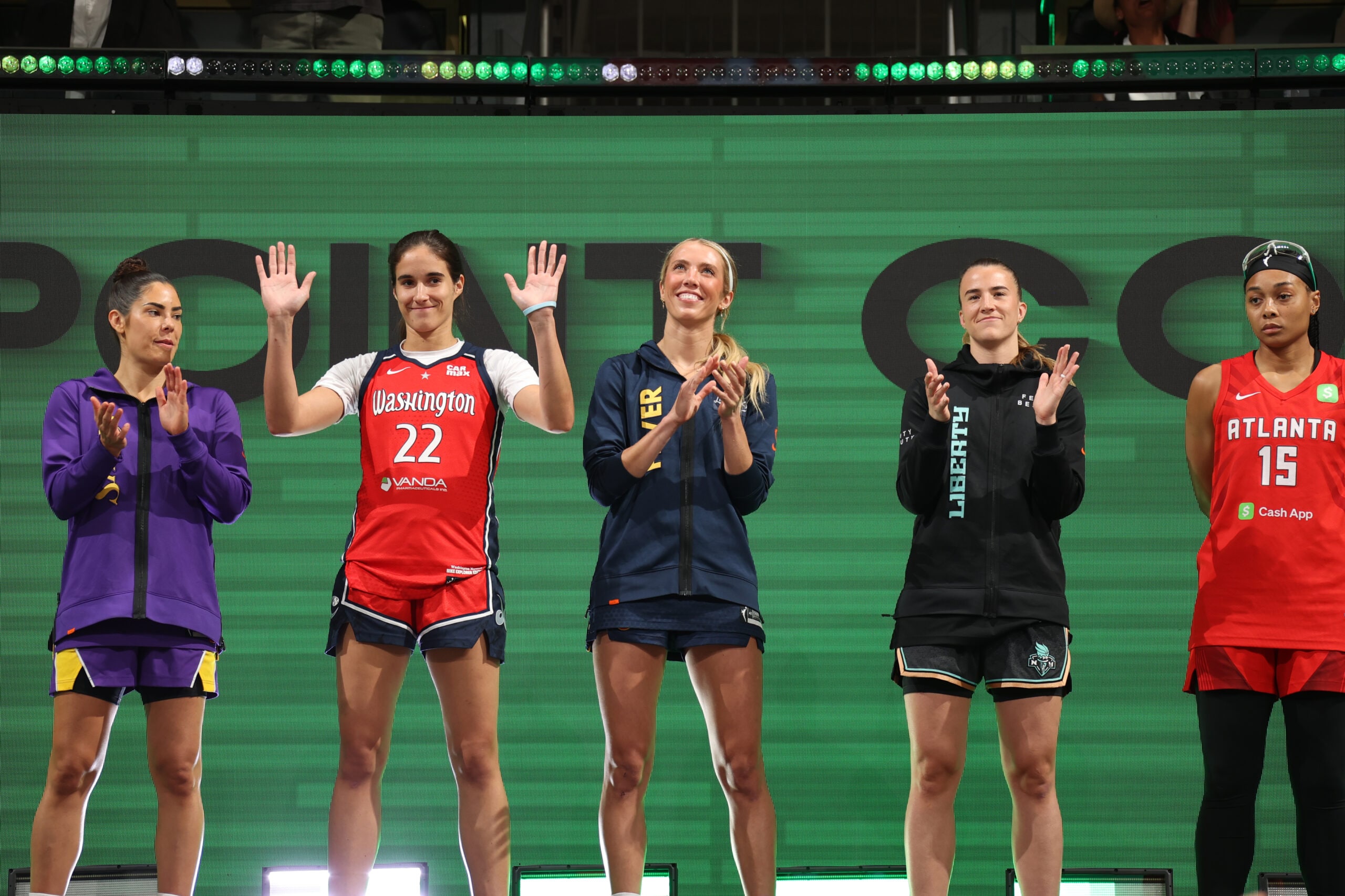 Kelsey Plum #10 of the Los Angeles Sparks, Sonia Citron #22 of the Washington Mystics, Lexie Hull #10 of the Indiana Fever, Sabrina Ionescu #20 of the New York Liberty, and Allisha Gray #15 of the Atlanta Dream look on during the Kia WNBA Skills Challenge and WNBA STARRY 3-Point Contest on July 18, 2025 at Gainbridge Fieldhouse in Indianapolis, Indiana.