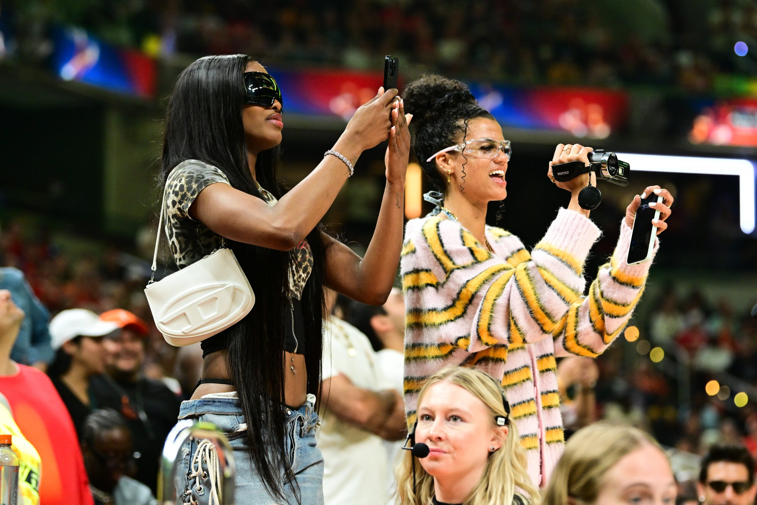 Rae Burrell #12 and Rickea Jackson #2 of the Los Angeles Sparks look on during the Kia WNBA Skills Challenge and WNBA STARRY 3-Point Contest on July 18, 2025 at Gainbridge Fieldhouse in Indianapolis, Indiana.