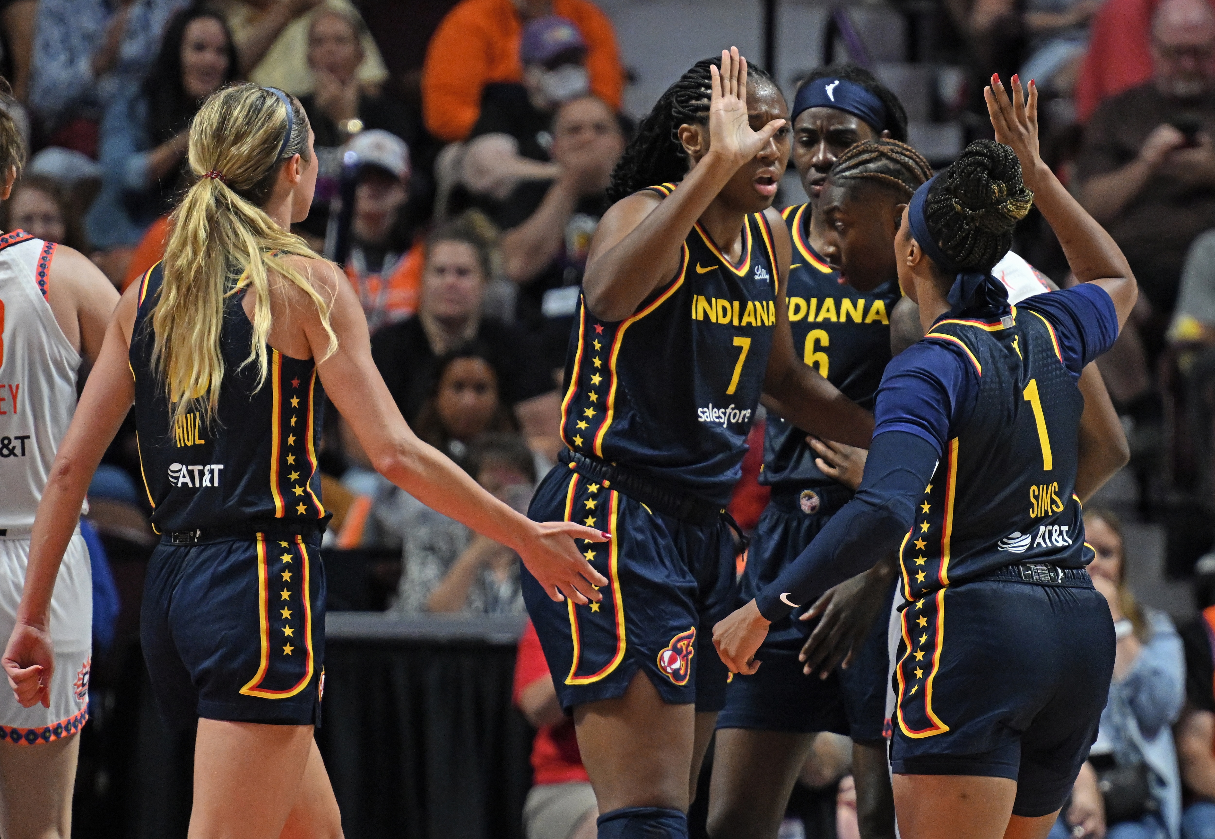 Aliyah Boston #7 and Odyssey Sims #1 of the Indiana Fever celebrate a basket