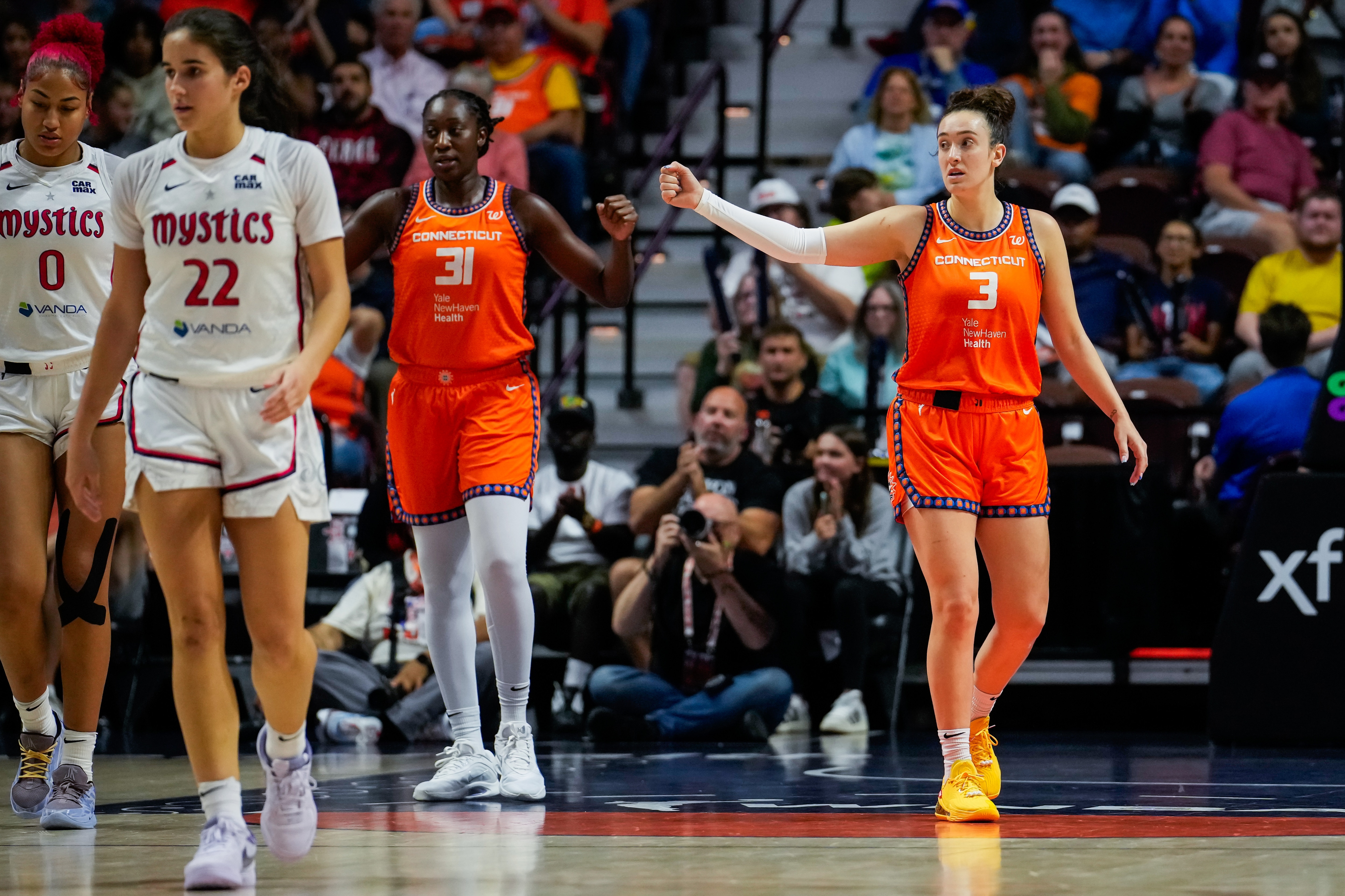 Tina Charles #31 and Marina Mabrey #3 of the Connecticut Sun play against the Washington Mystics