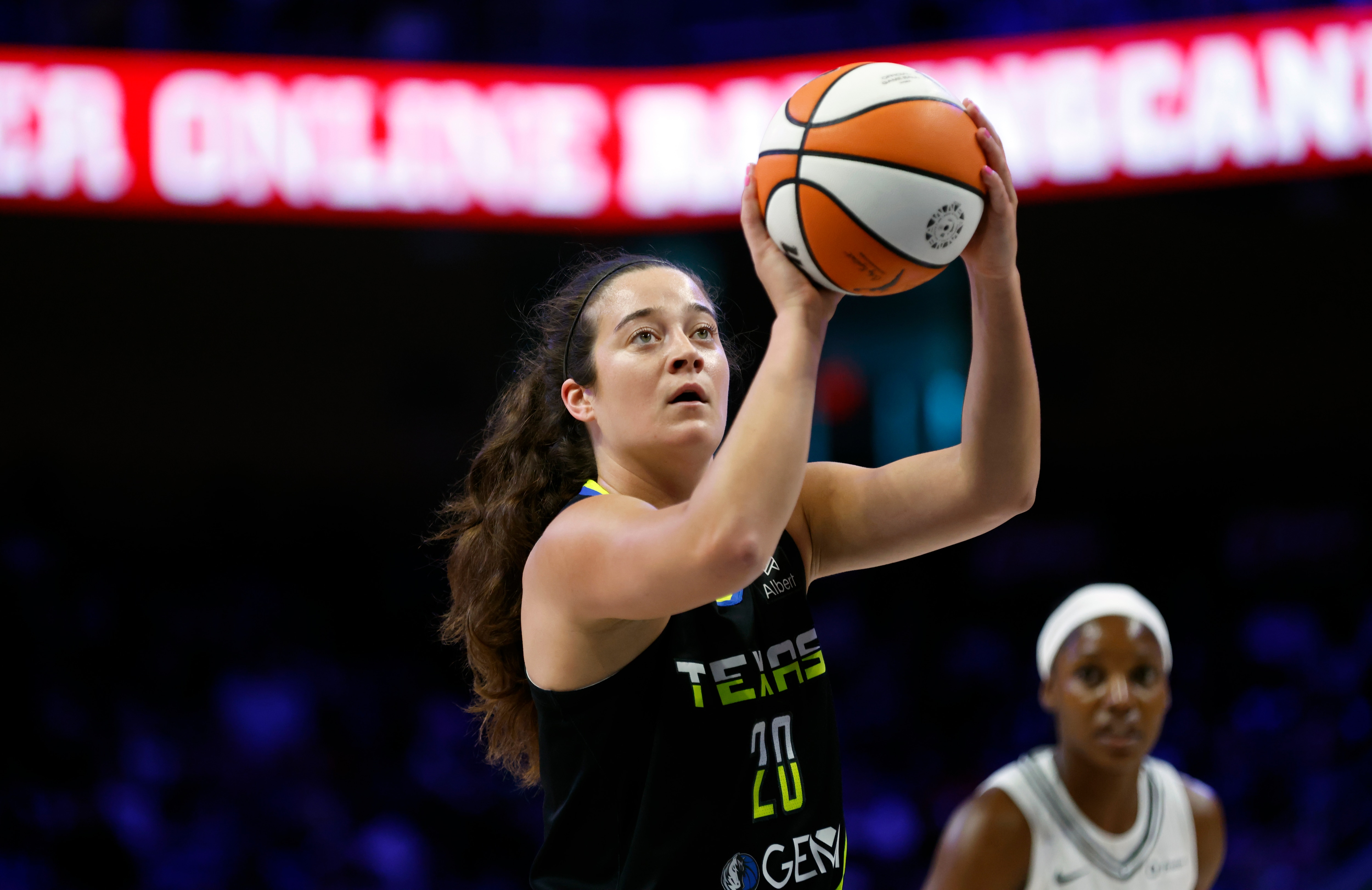 Maddy Siegrist #20 of the Dallas Wings shoots the ball against the Golden State Valkyries 