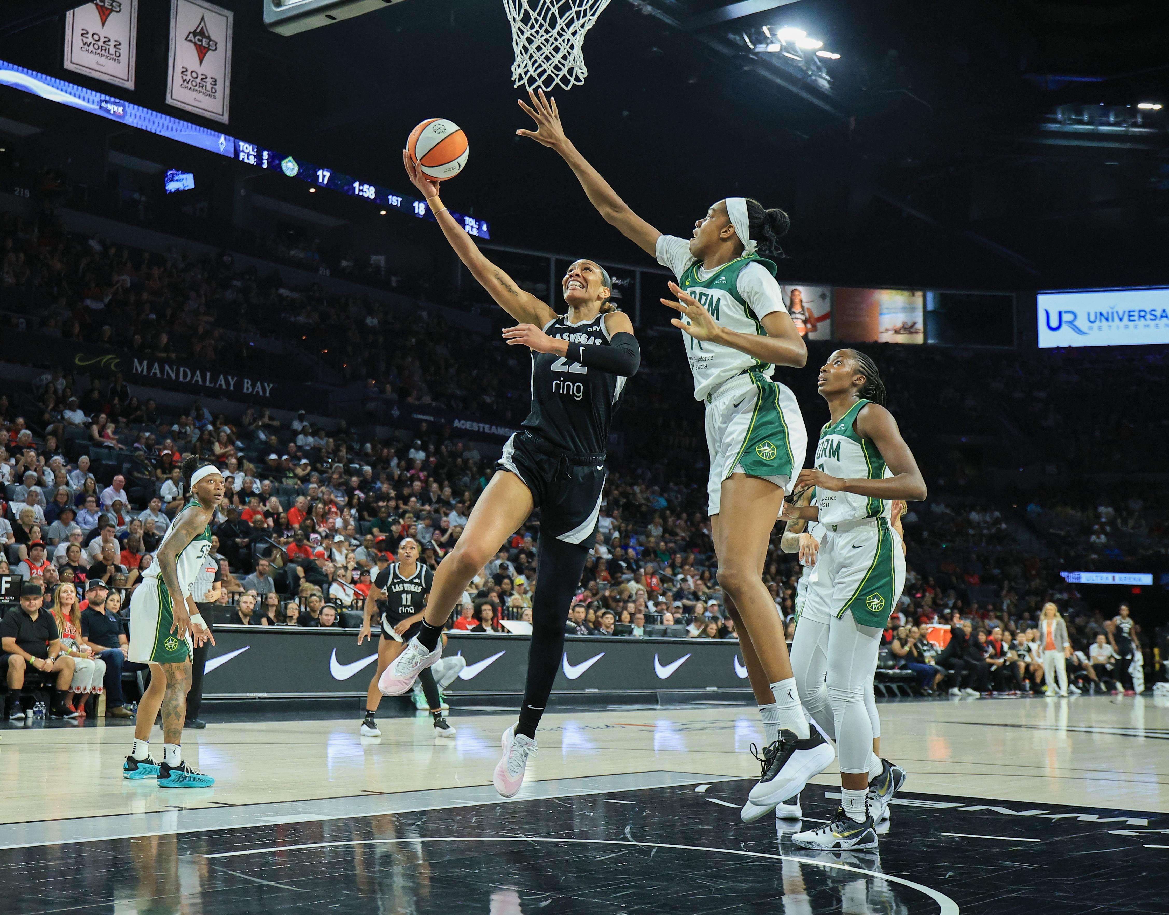 A'ja Wilson #22 of the Las Vegas Aces shoots a layup against Dominique Malonga #14 of the Seattle Storm 