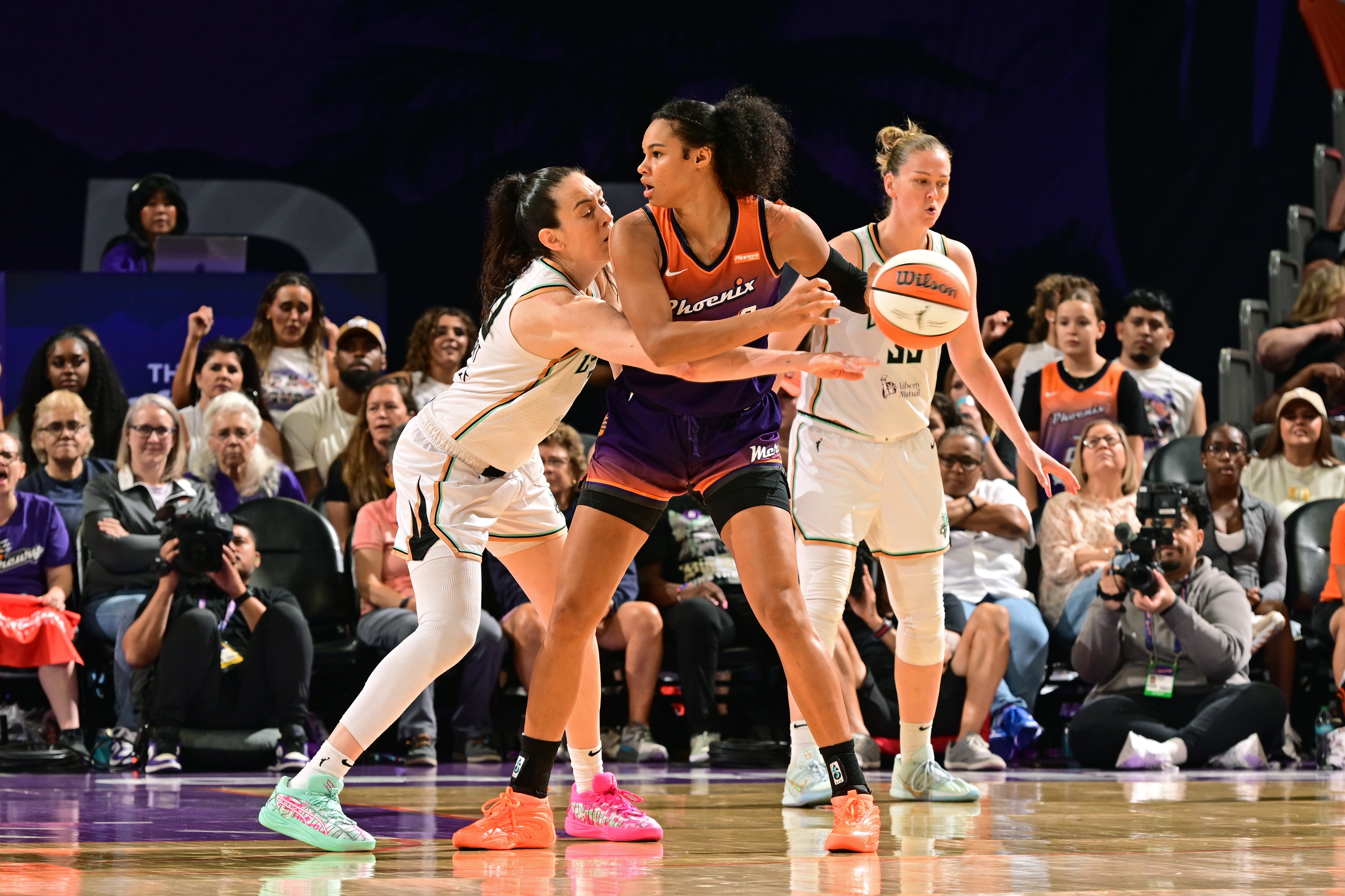 Satou Sabally #0 of the Phoenix Mercury looks to pass the ball as Breanna Stewart #30 of the New York Liberty plays defense during the game