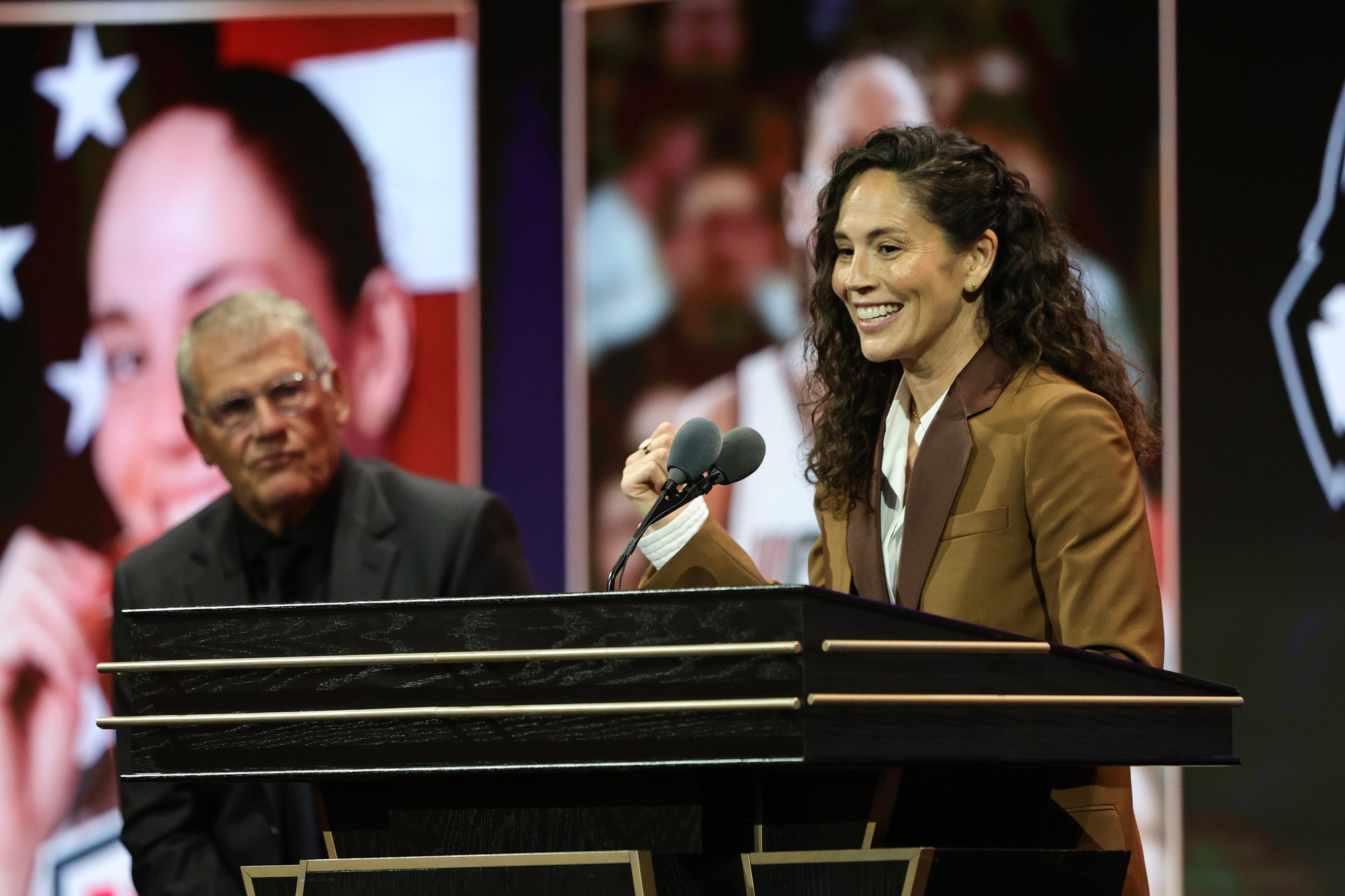 Sue Bird smiles speaking during the 2025 Basketball Hall of Fame Enshrinement Ceremony on September 6, 2025 at Symphony Hall in Springfield, Massachusetts.