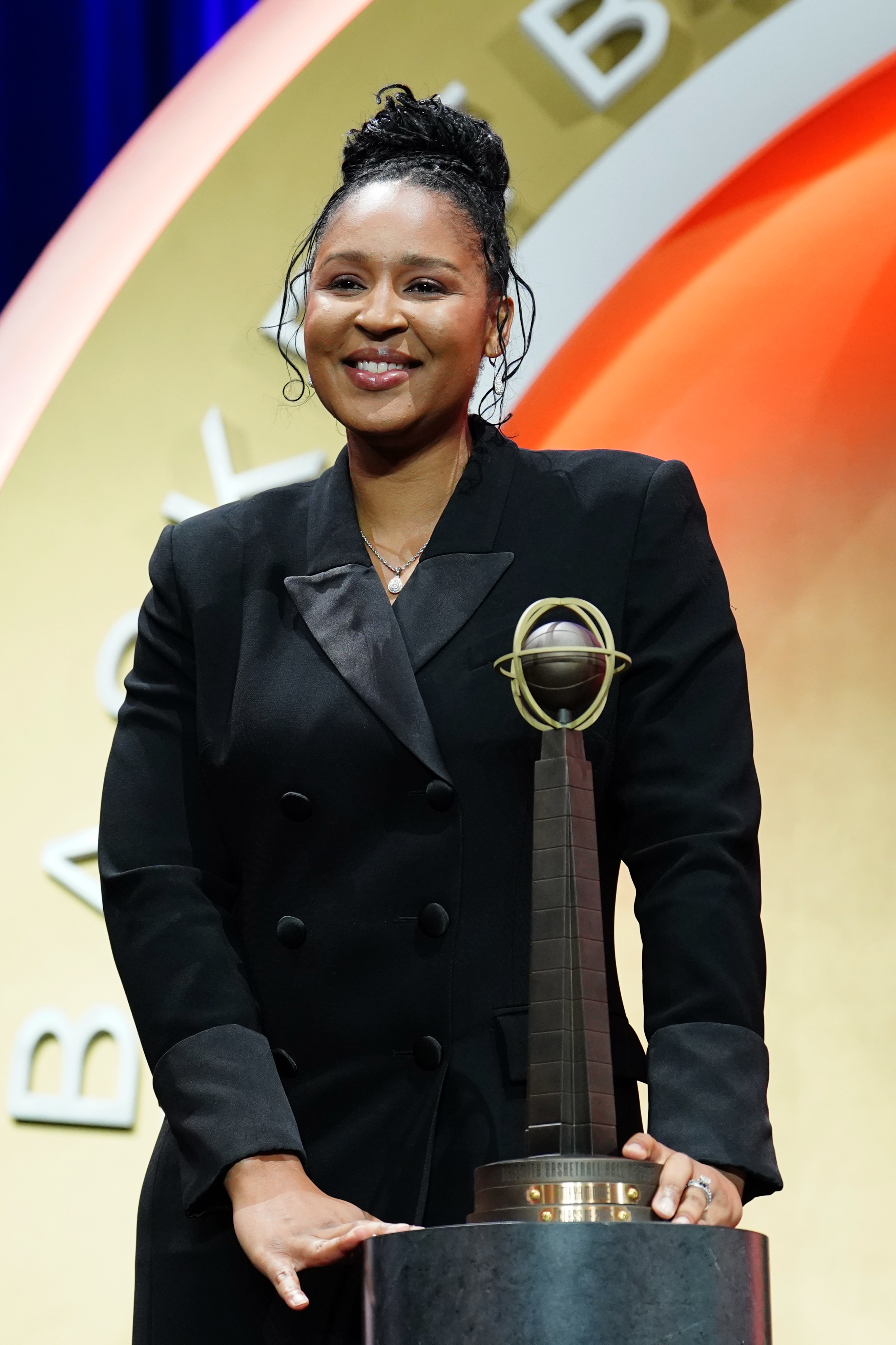 Maya Moore smiles on stage during the 2025 Basketball Hall of Fame Enshrinement Ceremony on September 6, 2025 at the Naismith Basketball Hall of Fame in Springfield, Massachusetts.