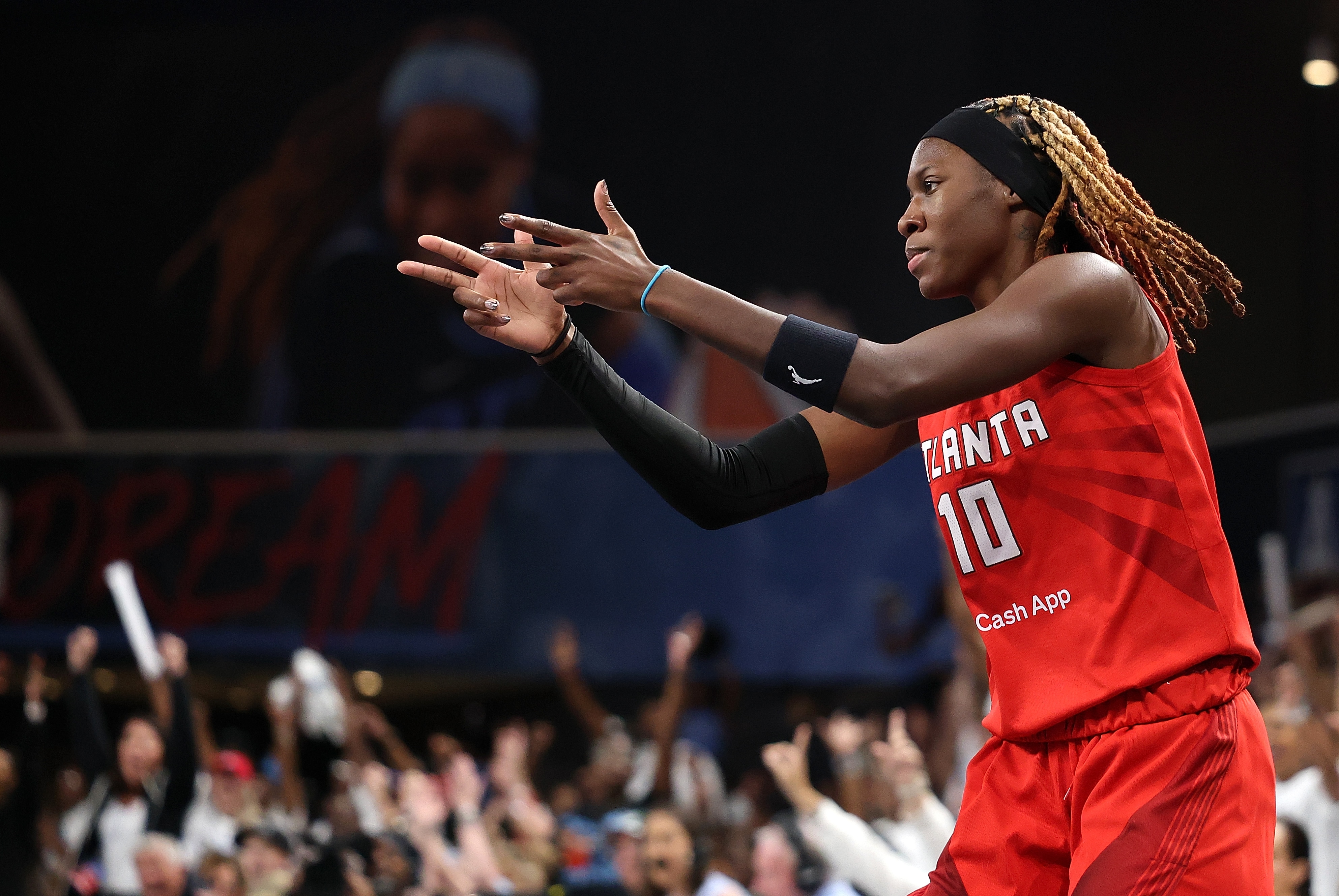Rhyne Howard #10 of the Atlanta Dream reacts after hitting a three-point basket against the Indiana Fever