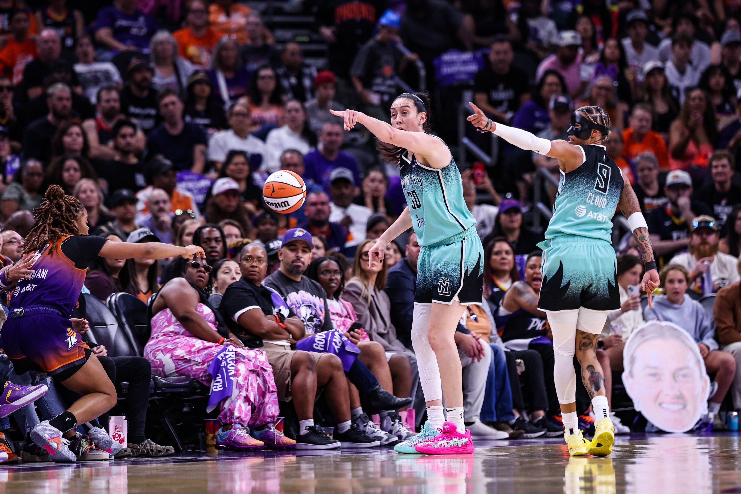 Breanna Stewart #30 of the New York Liberty and Natasha Cloud #9 both point down the court in hopes they gained possession of the ball