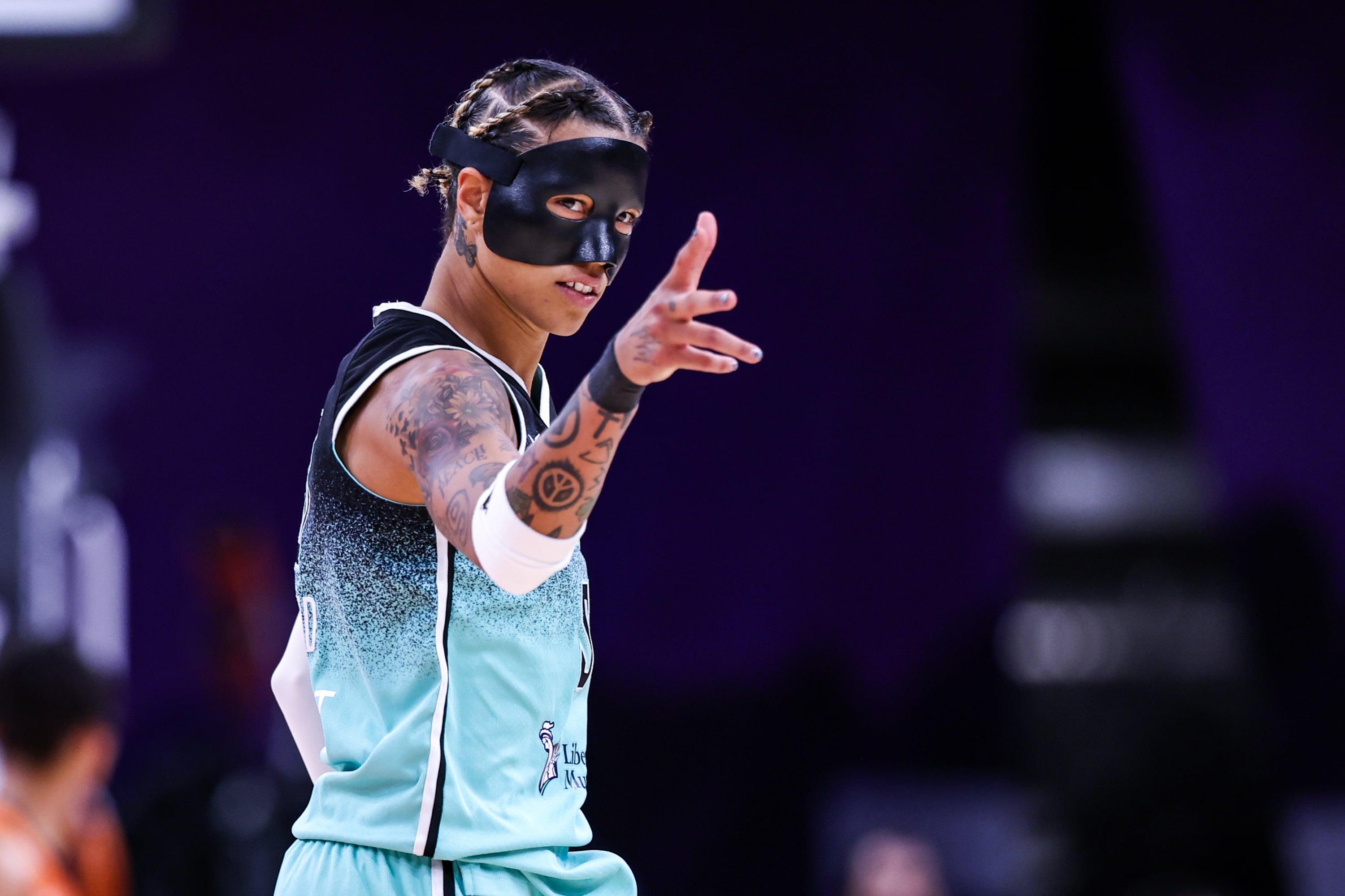 Natasha Cloud #9 of the New York Liberty holds up a three after she made a three pointer during overtime against the Phoenix Mercury