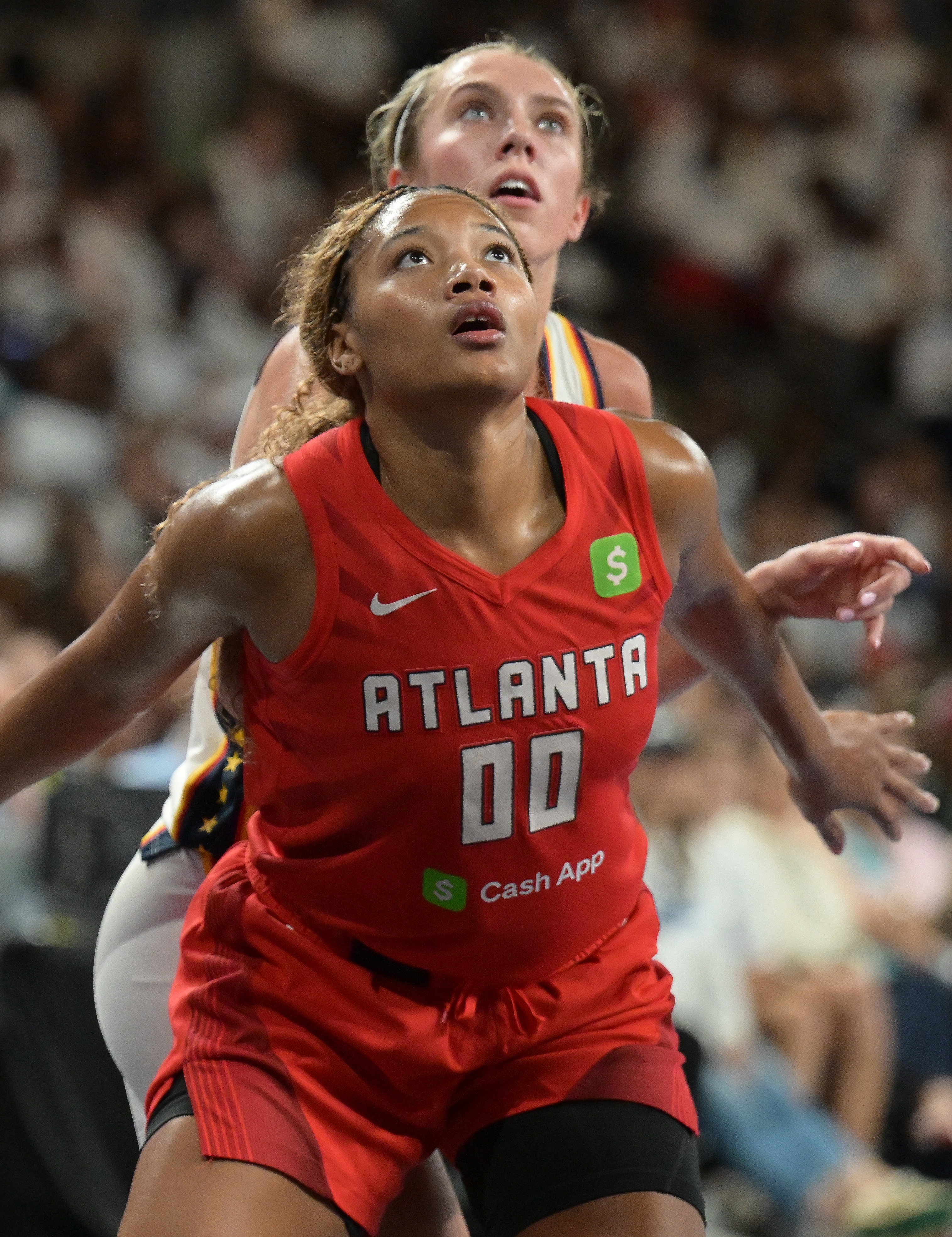 Naz Hillmon #00 of the Atlanta Dream and Lexie Hull #10 of the Indiana Fever look on