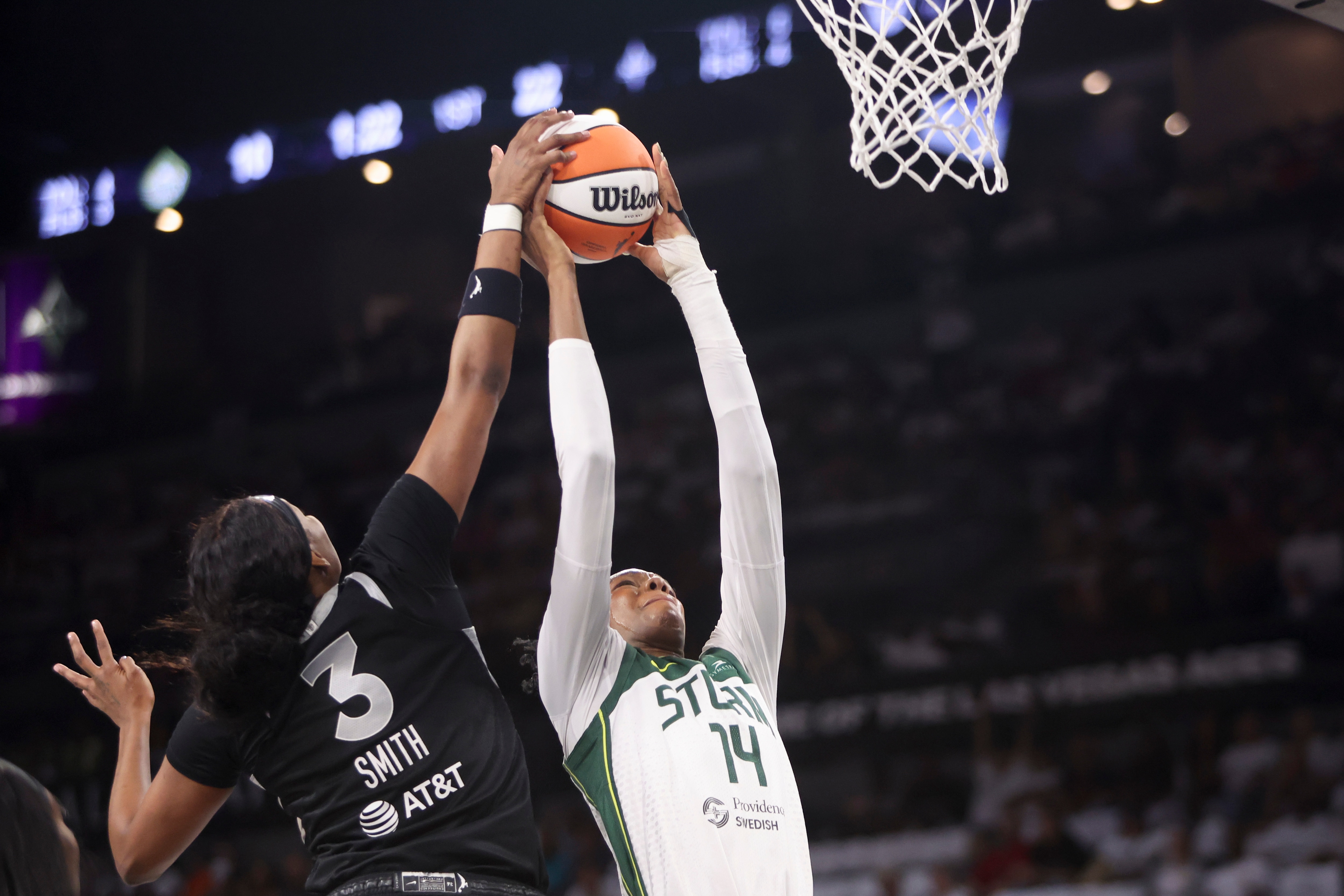 NaLyssa Smith #3 of the Las Vegas Aces blocks a shot from Dominique Malonga #14 of the Seattle Storm