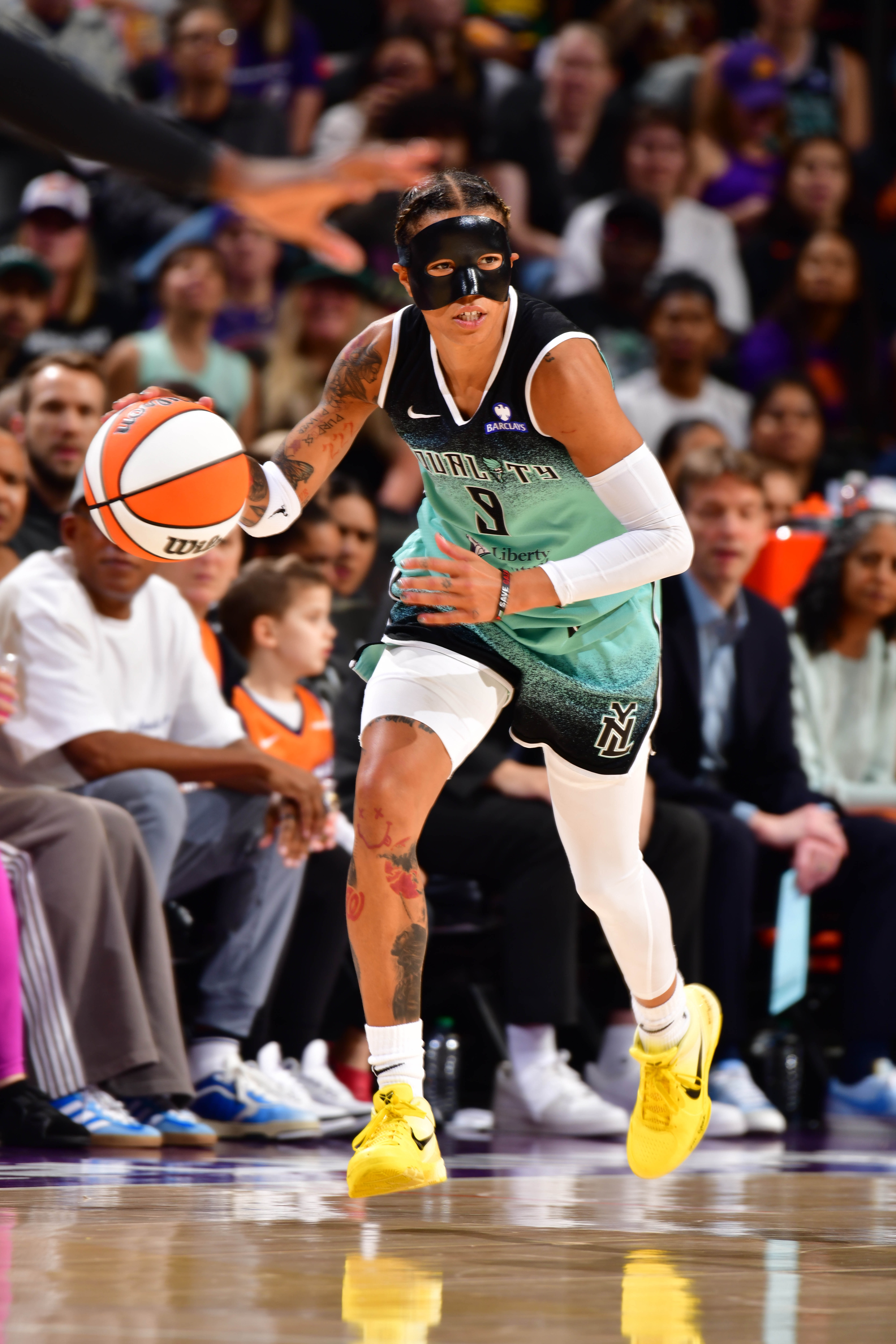 Natasha Cloud #9 of the New York Liberty handles the ball during the game against the Phoenix Mercury