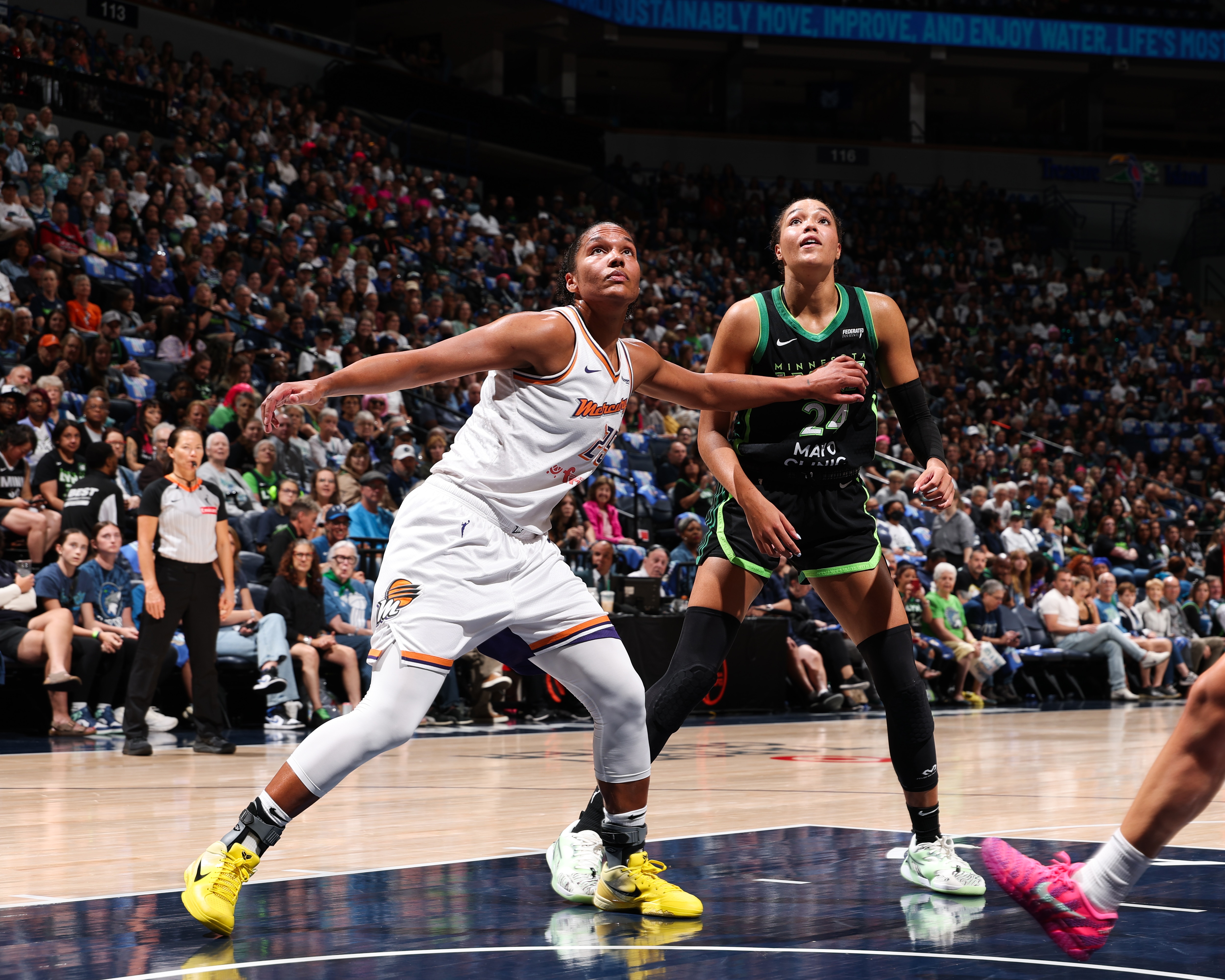 Alyssa Thomas #25 of the Phoenix Mercury plays defense during the game against Napheesa Collier #24 of the Minnesota Lynx