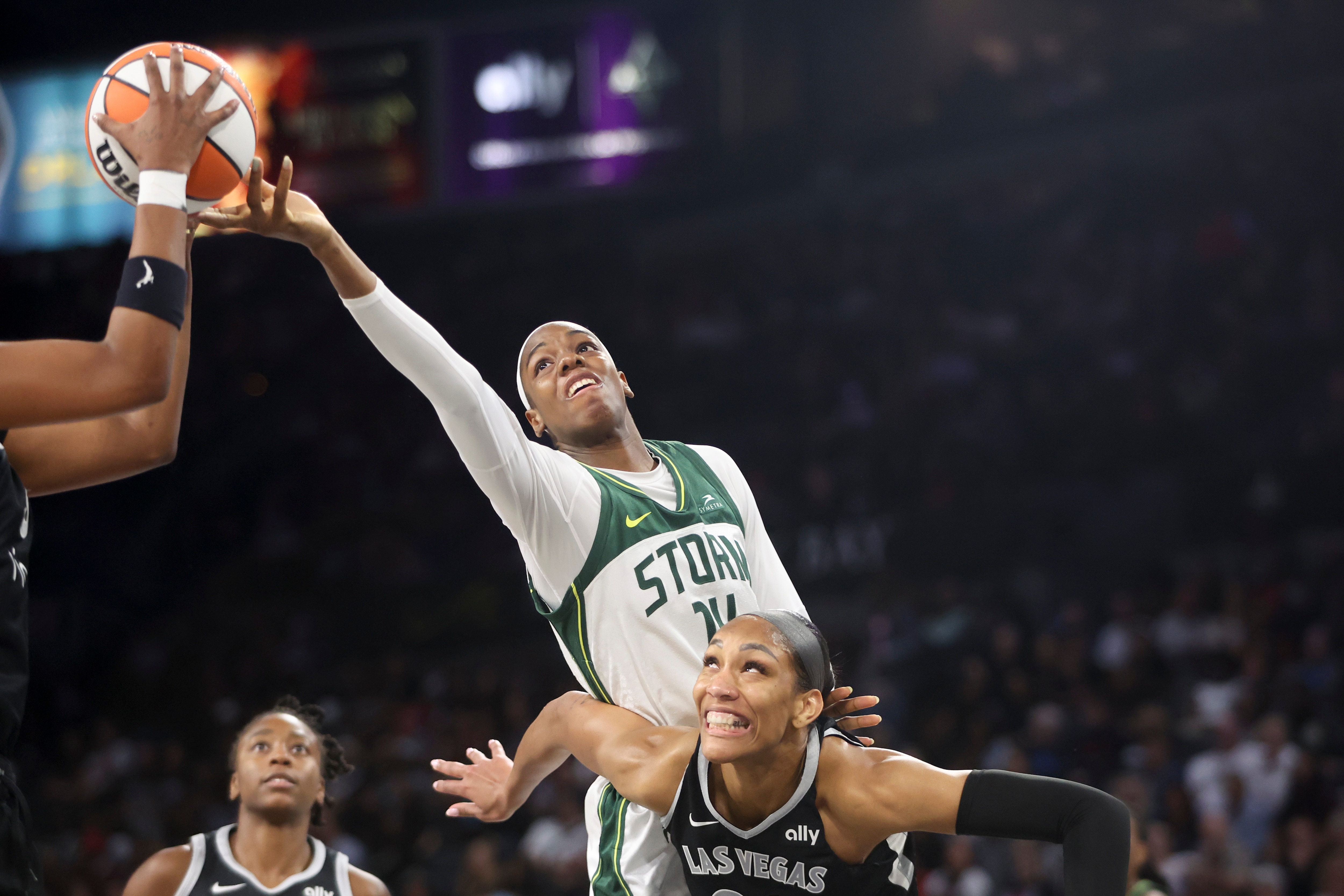 Dominique Malonga #14 of the Seattle Storm and A'ja Wilson #22 of the Las Vegas Aces vie for a rebound