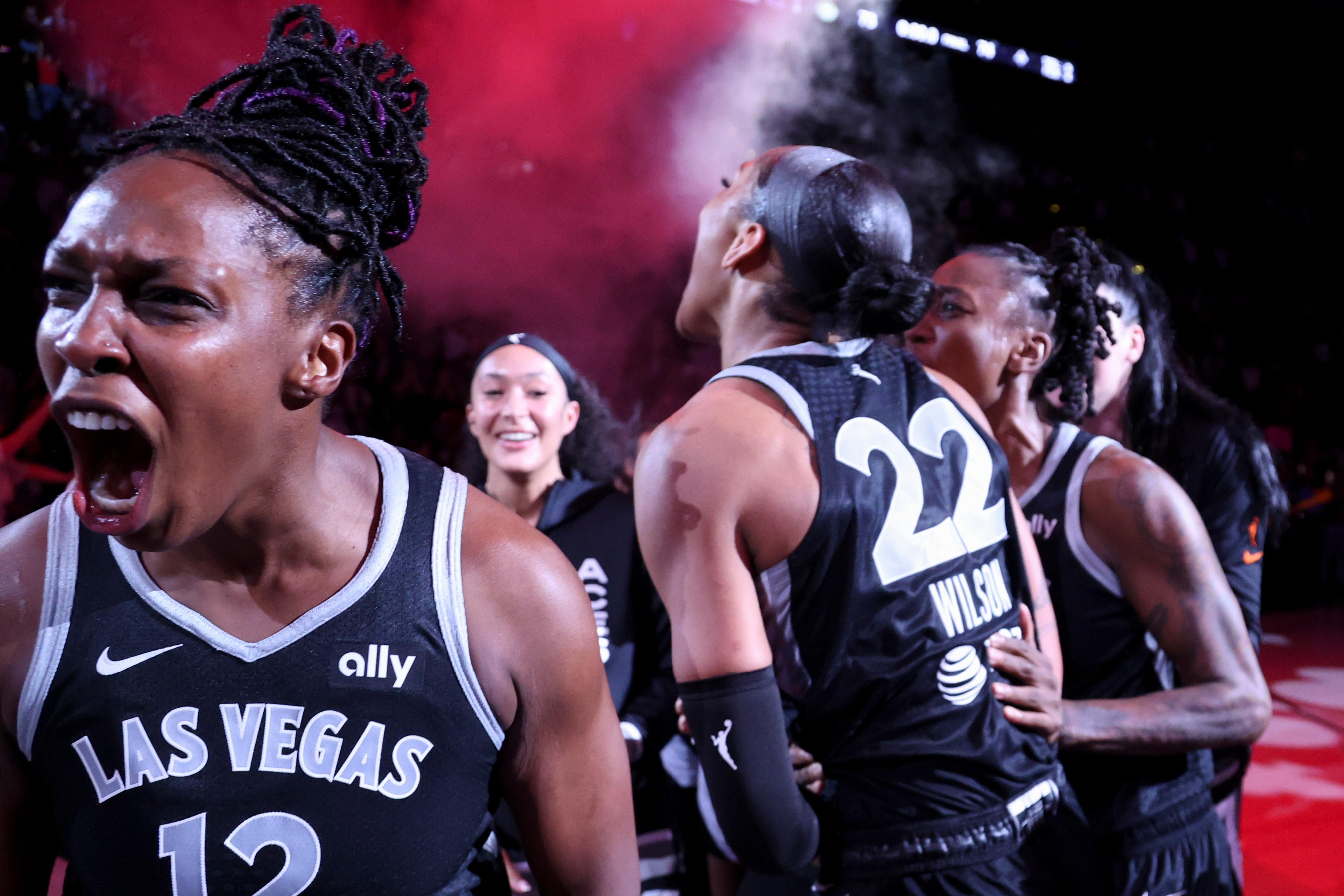 Chelsea Gray #12 of the Las Vegas Aces celebrates with teammates after her team's 74-73 victory against the Seattle Storm