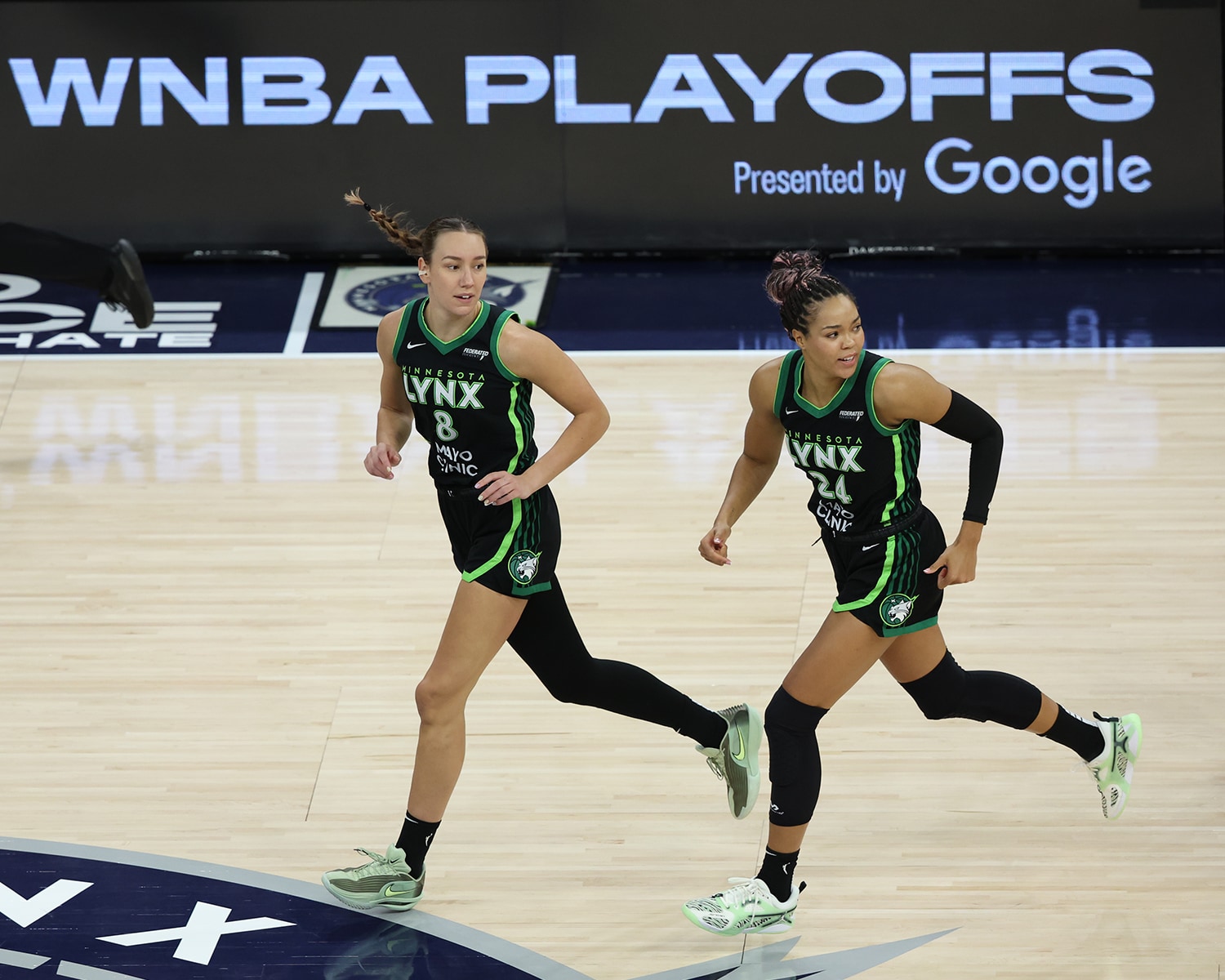 Alanna Smith #8 and Napheesa Collier #24 of the Minnesota Lynx looks on