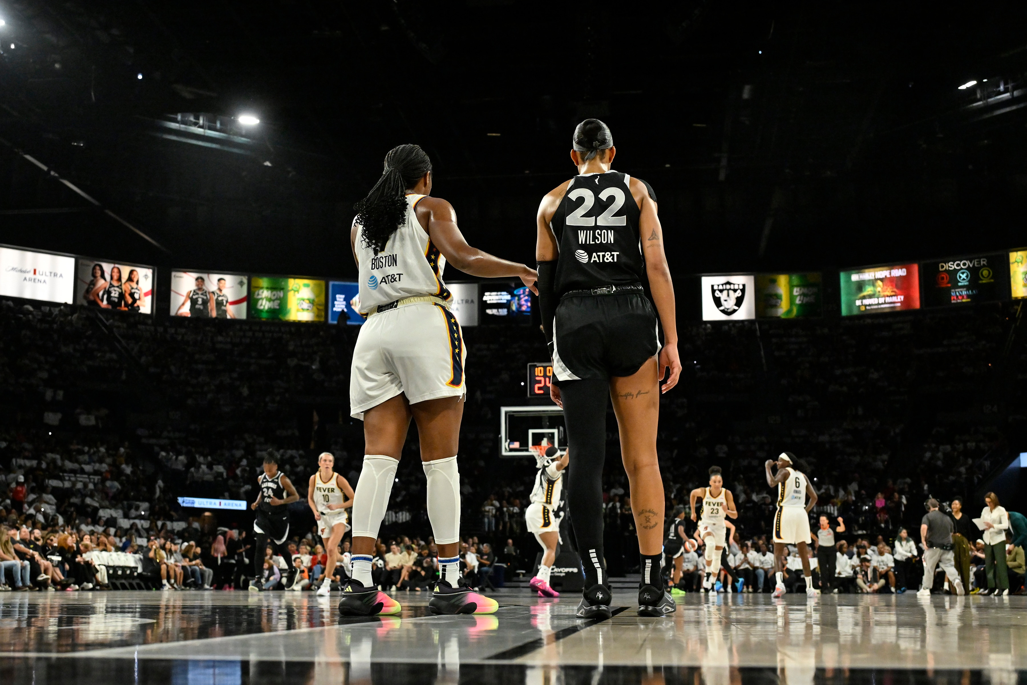 Aliyah Boston #7 of the Indiana Fever and A'ja Wilson #22 of the Las Vegas Aces look on