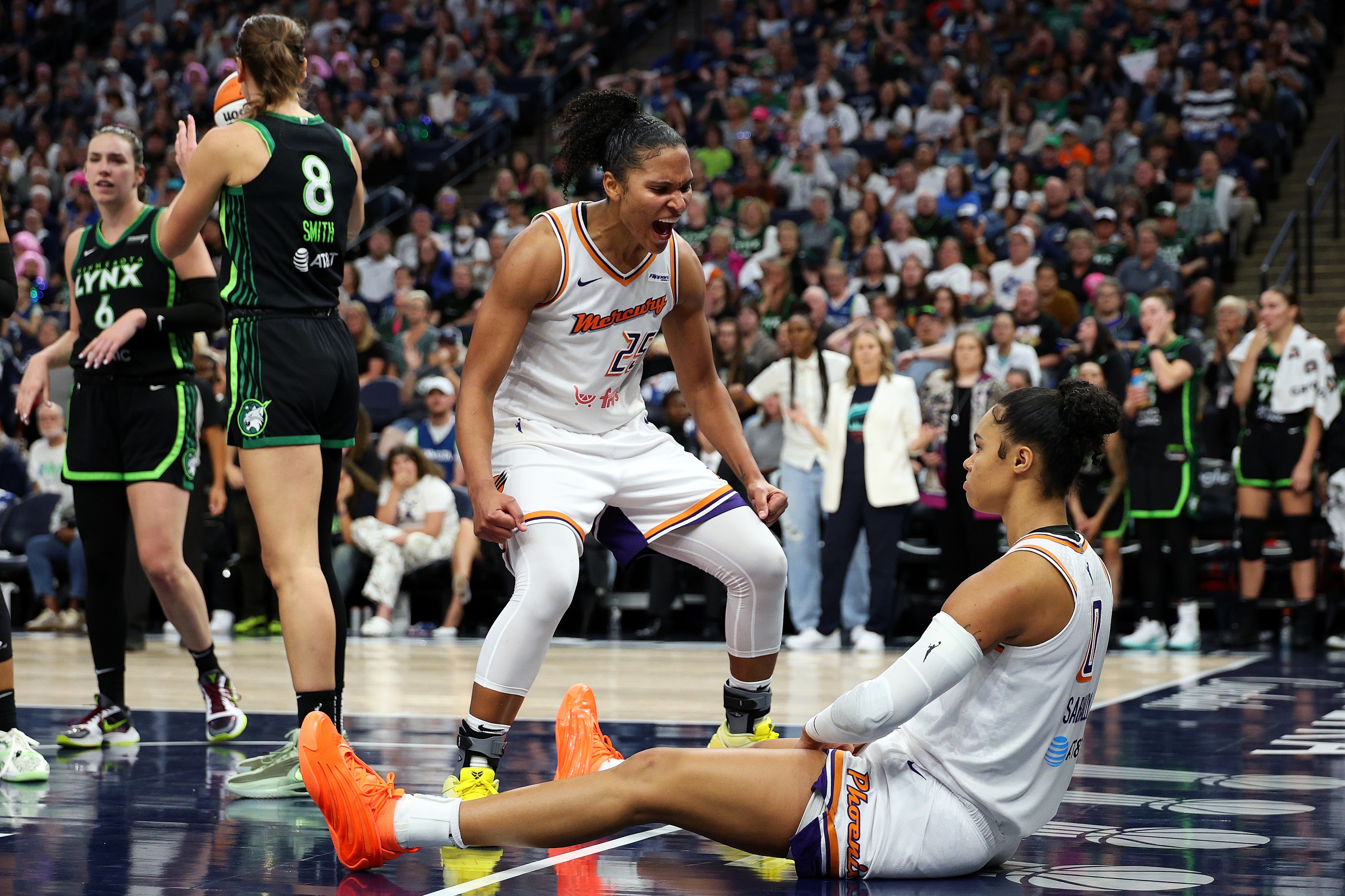 Satou Sabally #0 of the Phoenix Mercury celebrates with teammate Alyssa Thomas #25 against the Minnesota Lynx