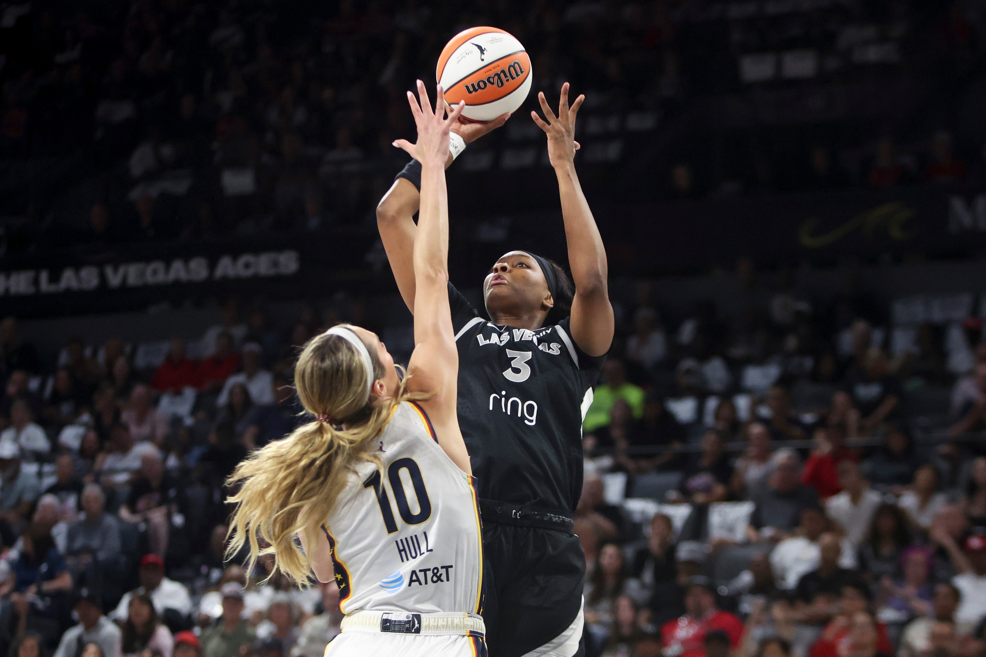 NaLyssa Smith #3 of the Las Vegas Aces shoots against Lexie Hull #10 of the Indiana Fever
