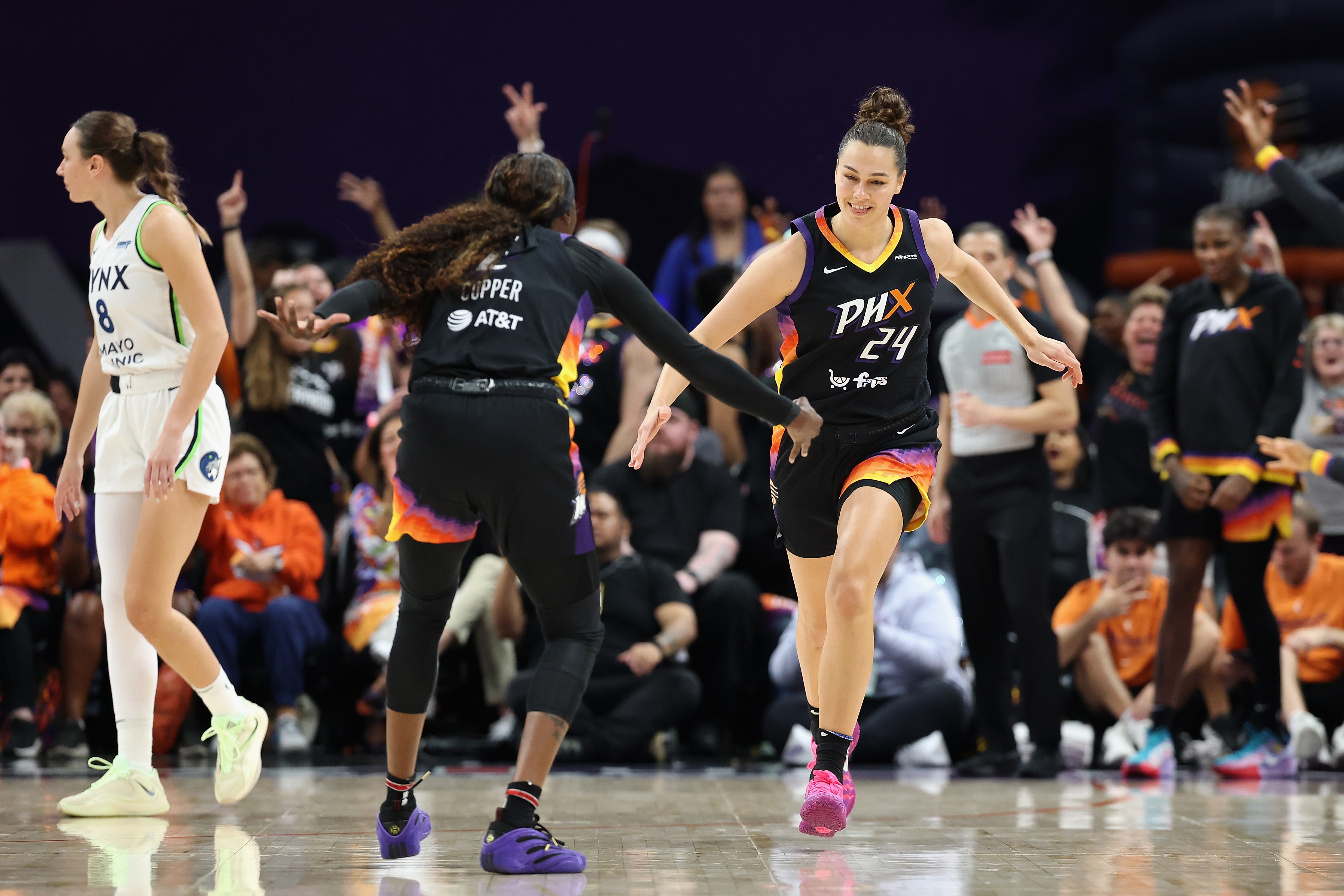 Kathryn Westbeld #24 of the Phoenix Mercury celebrates with Kahleah Copper #2 after a three-point shot against the Minnesota Lynx