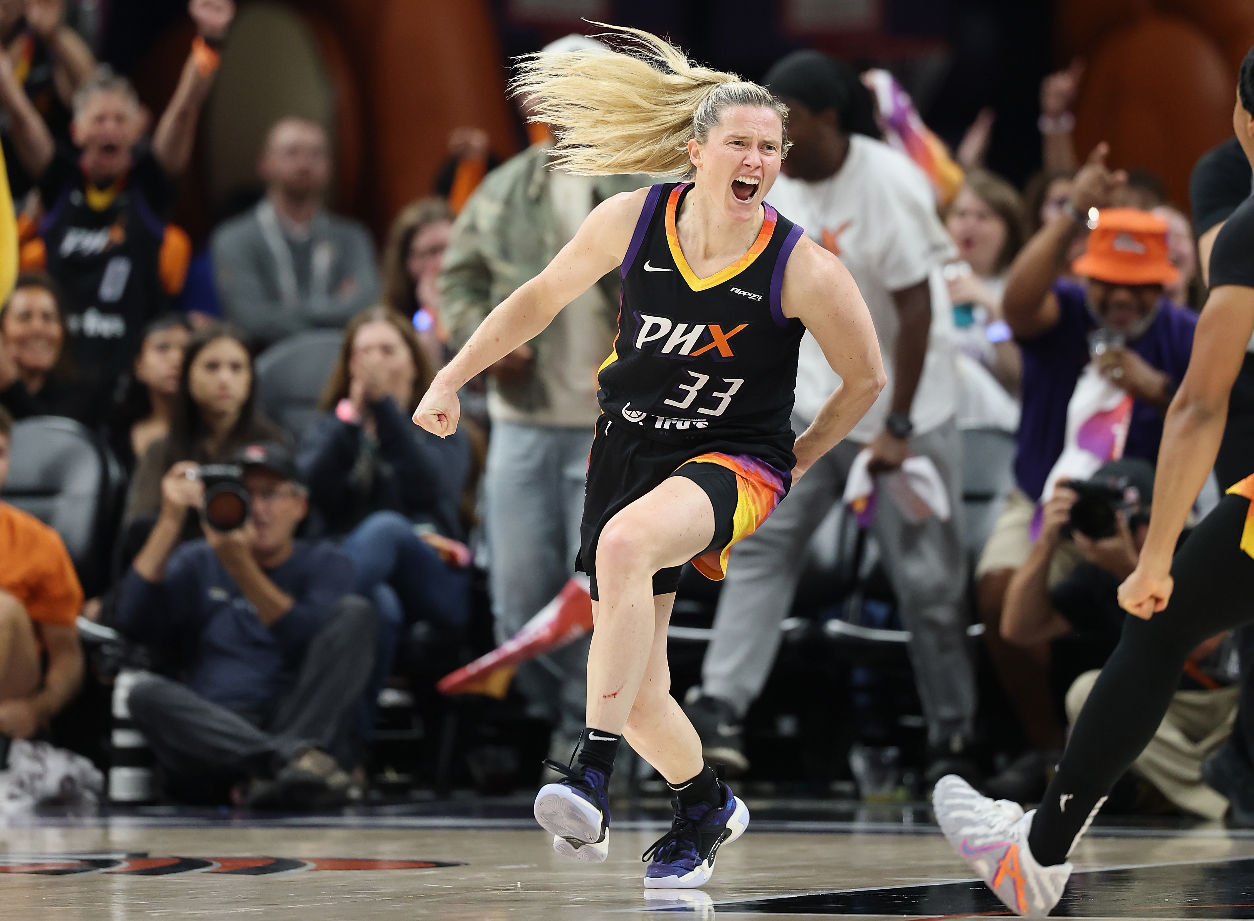 Sami Whitcomb #33 of the Phoenix Mercury celebrates after scoring against the Minnesota Lynx