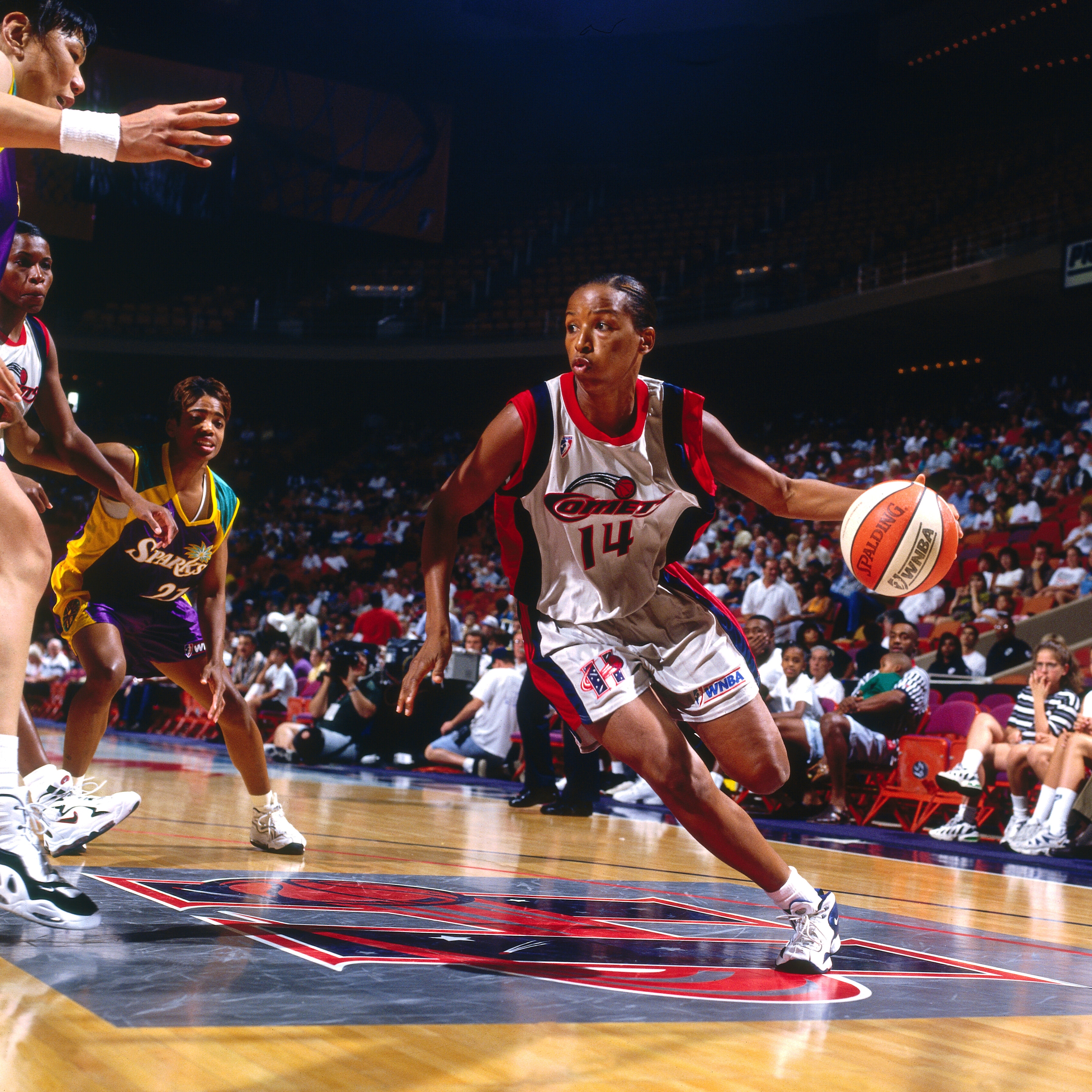 Cynthia Cooper #14 of the Houston Comets handles the ball against the Los Angeles Sparks on June 30, 1997