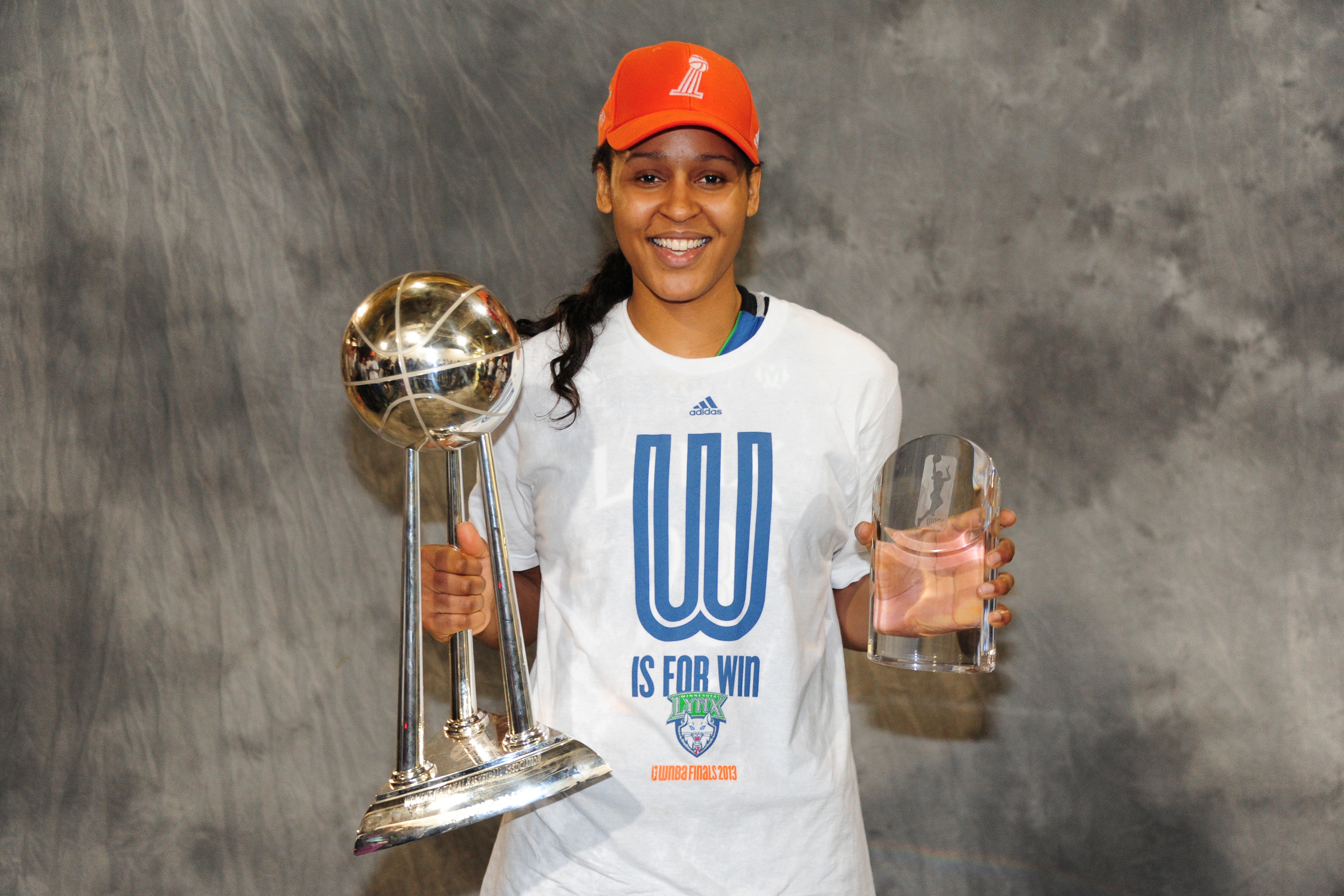 Maya Moore #23 of the Minnesota Lynx poses for a picture with the trophy after winning Game 3 of the 2013 WNBA Finals and being named the finals Most Valuable Player