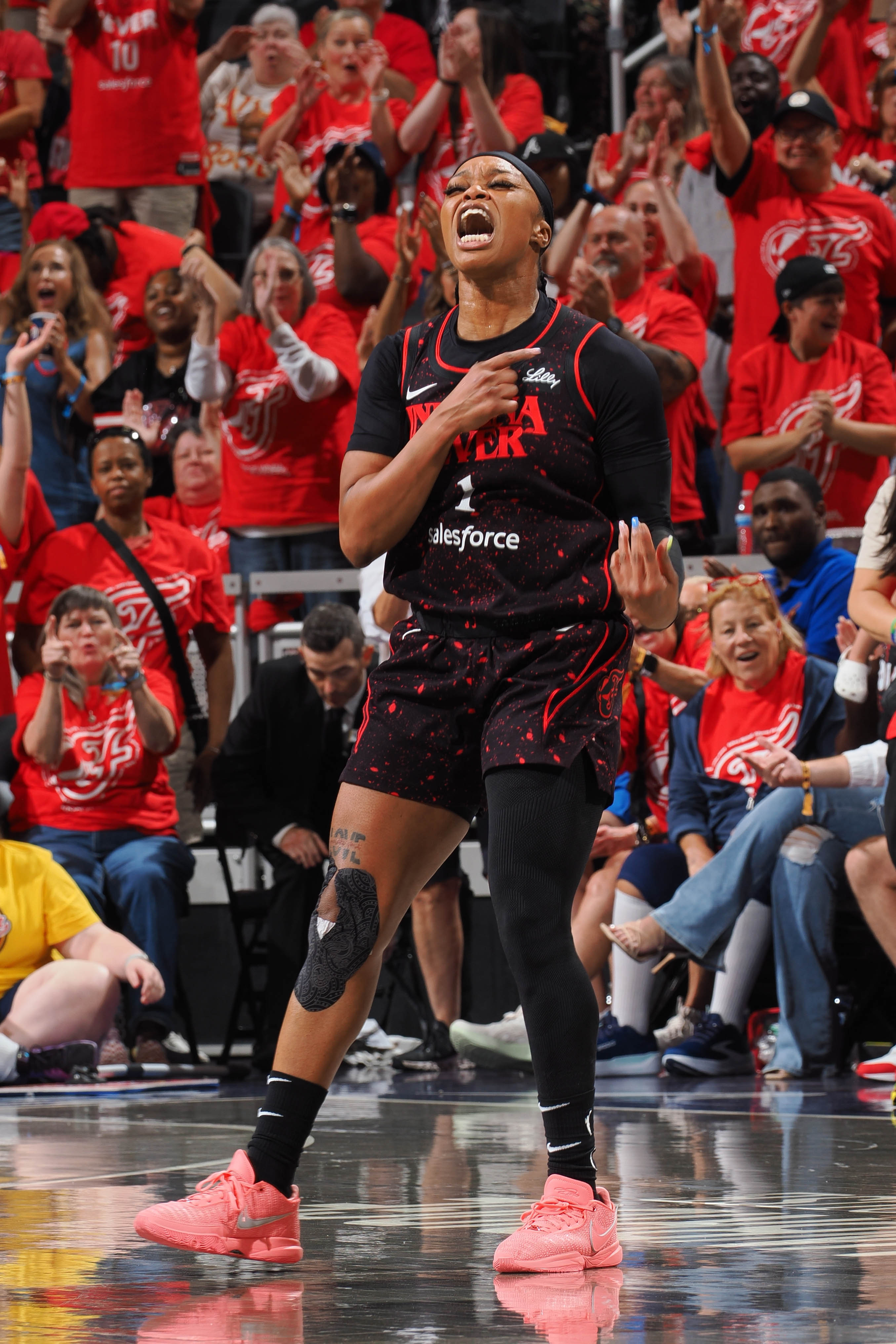 Odyssey Sims #1 of the Indiana Fever celebrates during the game against the Las Vegas Aces