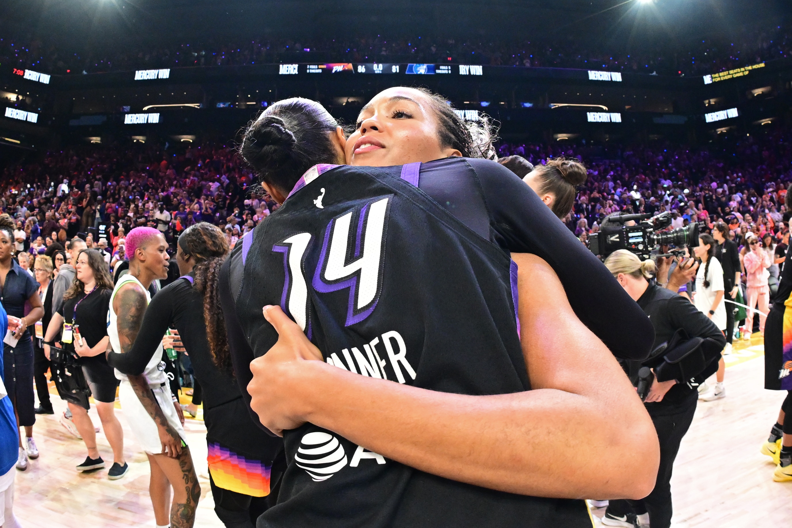 DeWanna Bonner #14 of the Phoenix Mercury hugs Napheesa Collier #24 of the Minnesota Lynx after the game