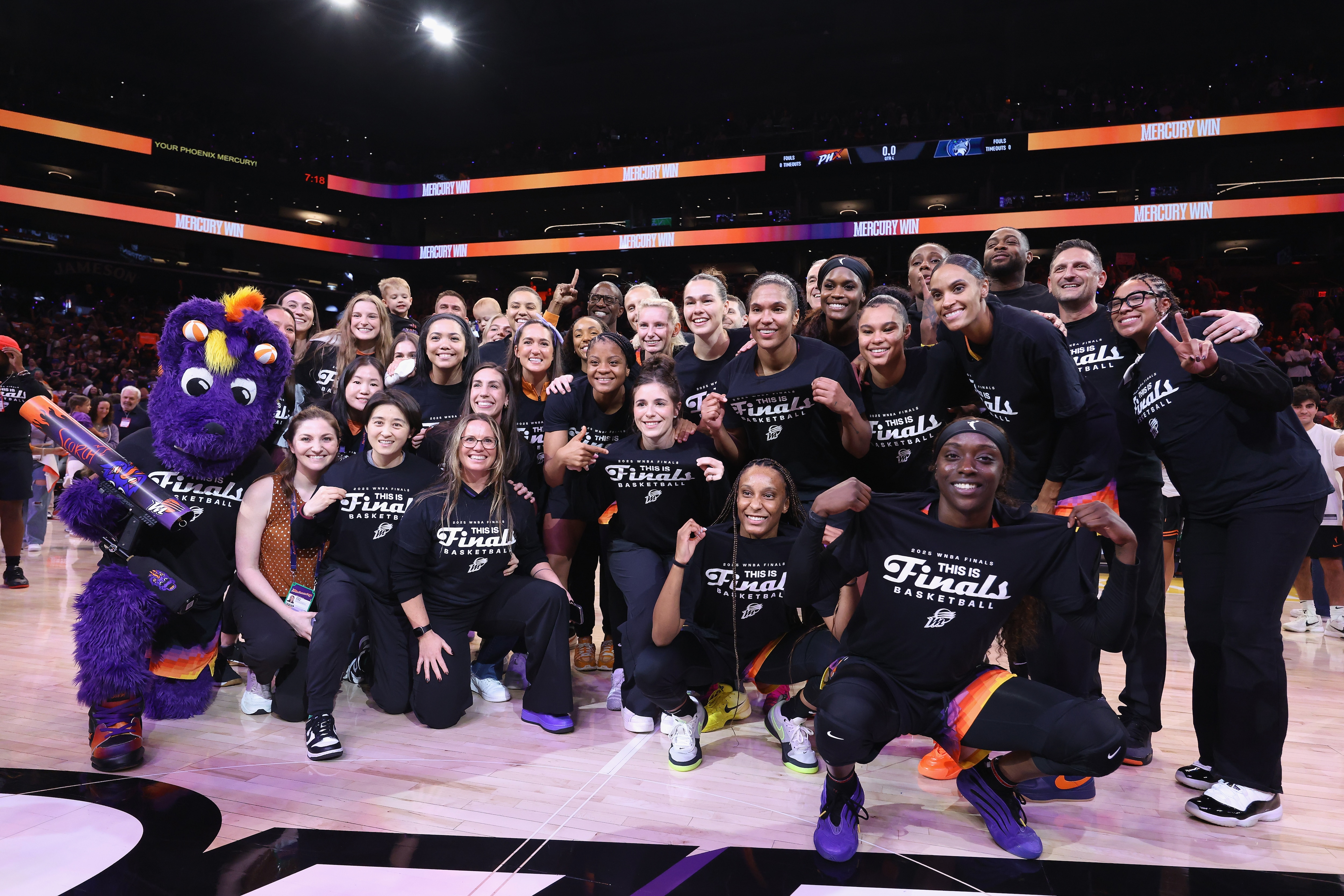 Phoenix Mercury players and coaches pose for a photograph after defeating the Minnesota Lynx in Game Four