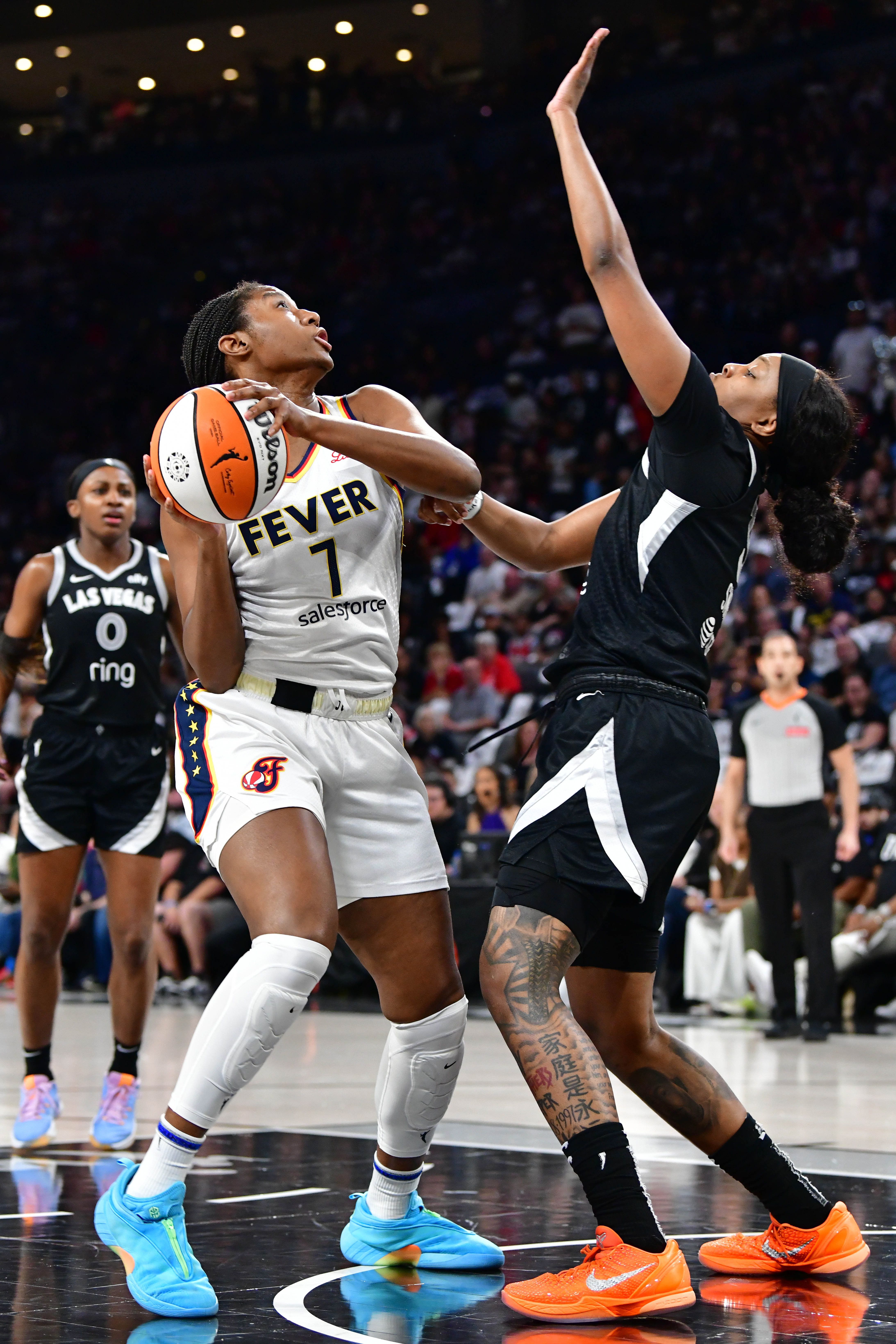 Aliyah Boston #7 of the Indiana Fever drives to the basket during the game against the Las Vegas Aces