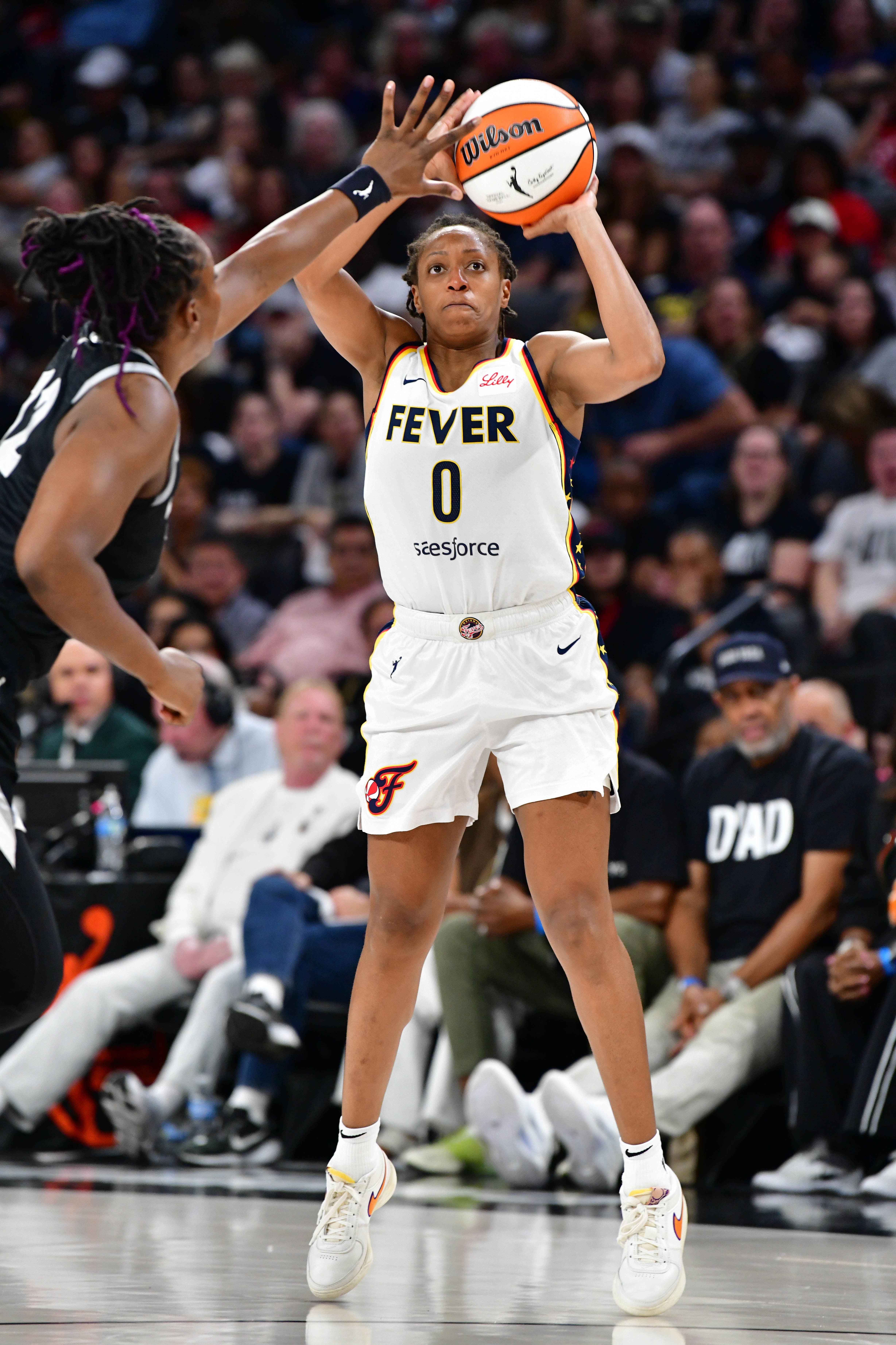 Kelsey Mitchell #0 of the Indiana Fever shoots a three point basket against the Las Vegas Aces