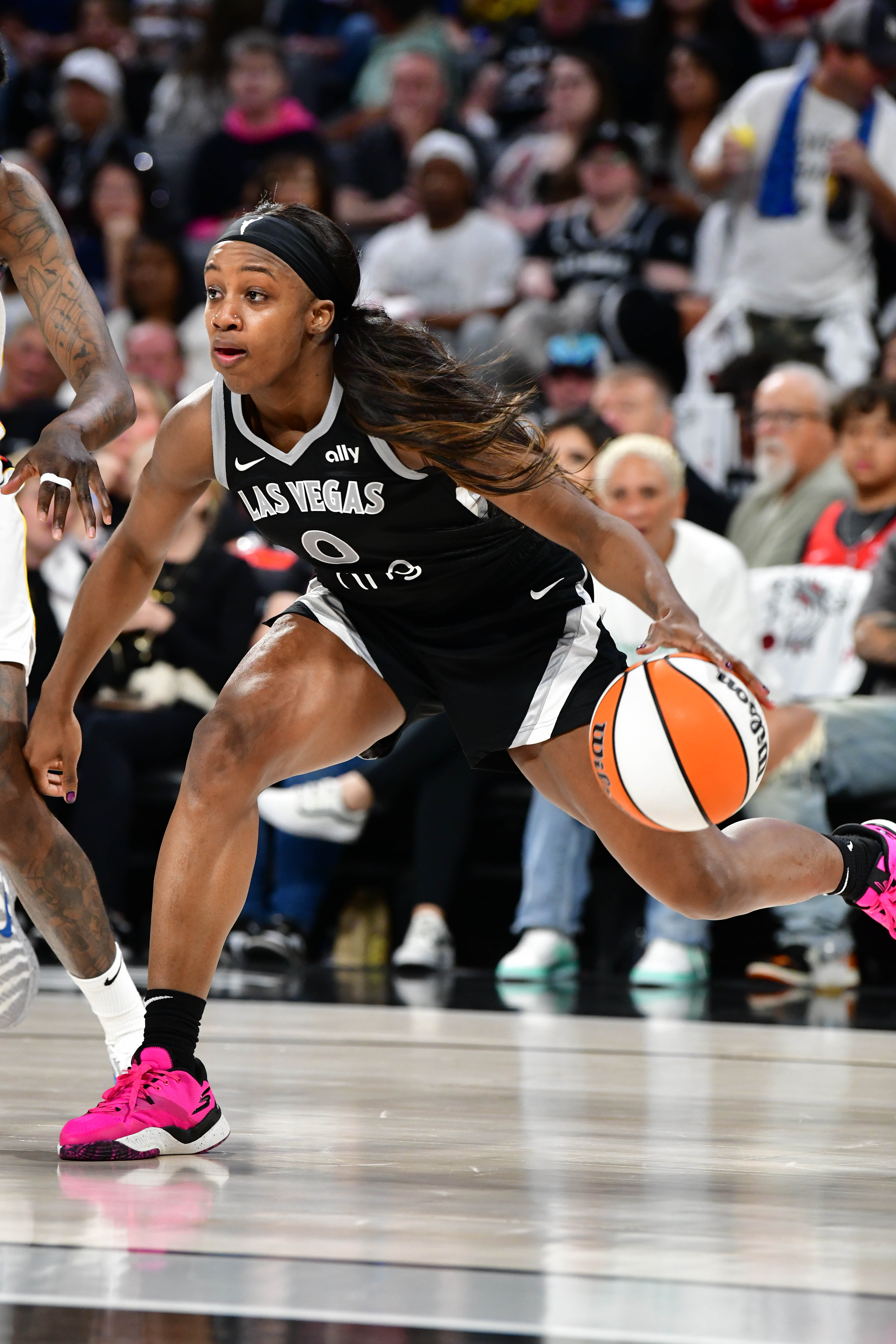 Jackie Young #0 of the Las Vegas Aces handles the ball during the game against the Indiana Fever