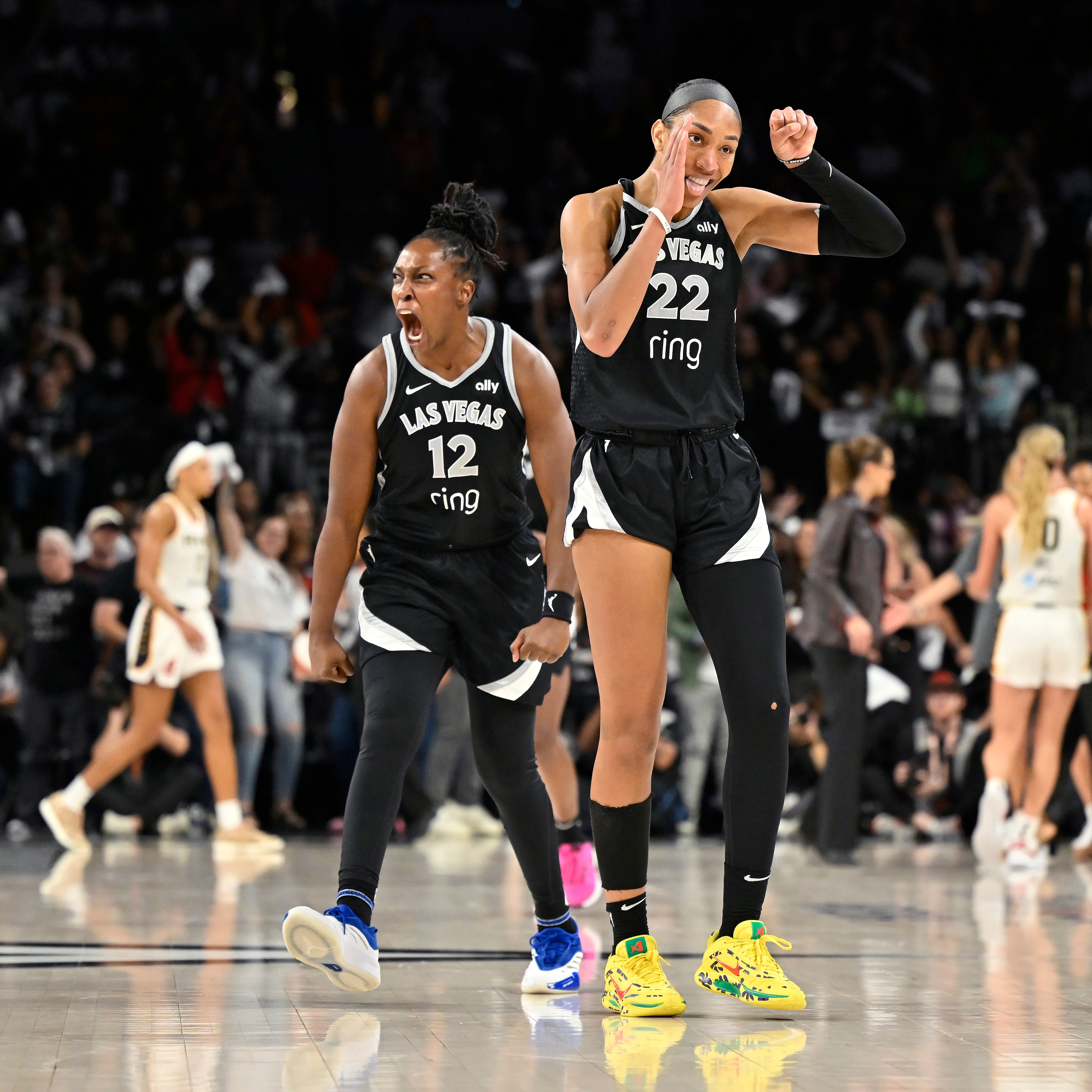 Chelsea Gray #12 and A'ja Wilson #22 of the Las Vegas Aces celebrate during the game against the Indiana Fever
