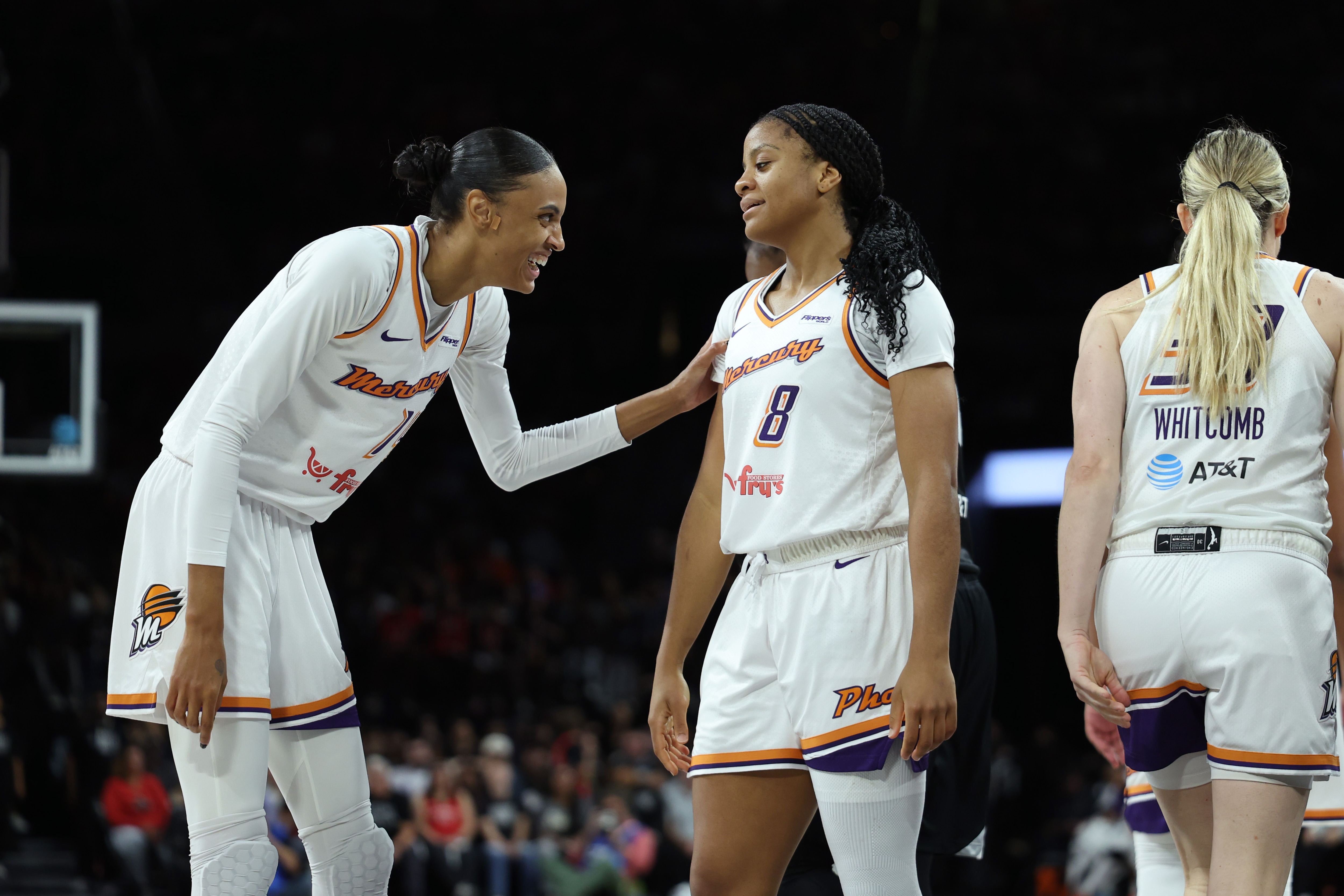 DeWanna Bonner #14 and Monique Akoa Makani #8 of the Phoenix Mercury smile during the game against the Las Vegas Aces
