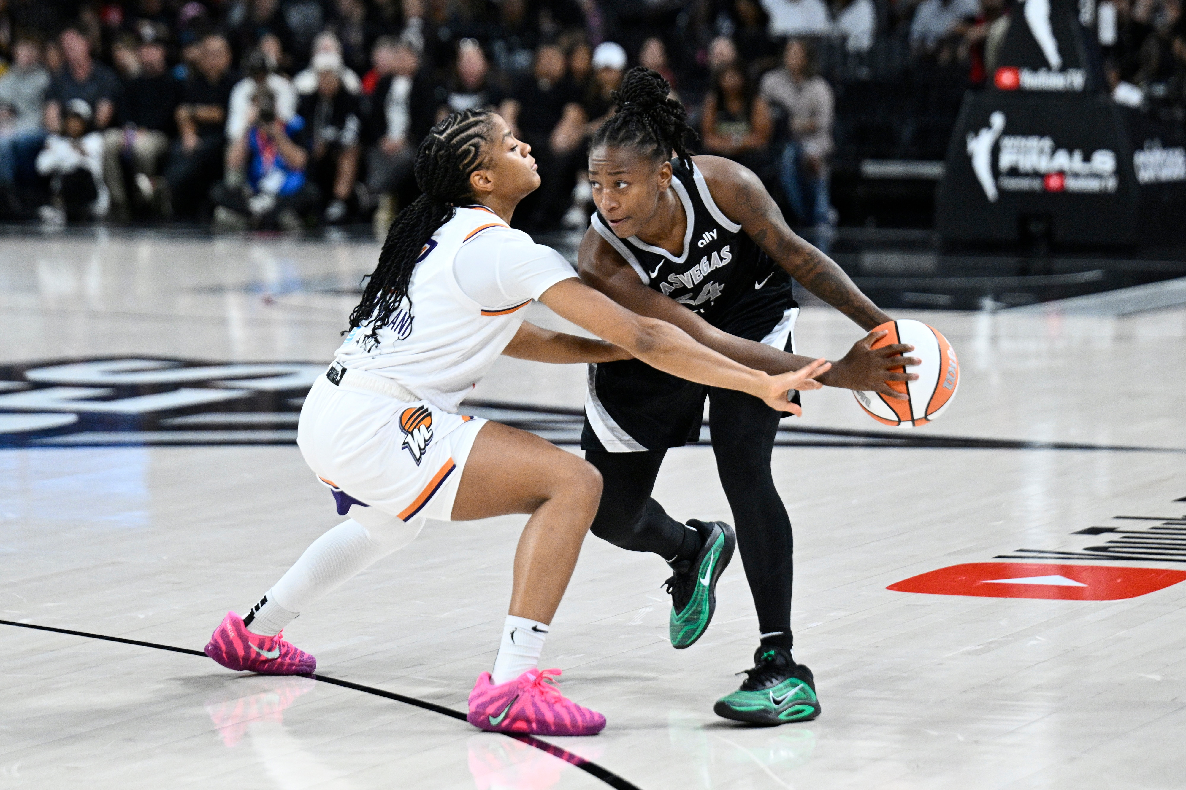 Jewell Loyd #24 of the Las Vegas Aces looks to pass the ball during the game against the Phoenix Mercury